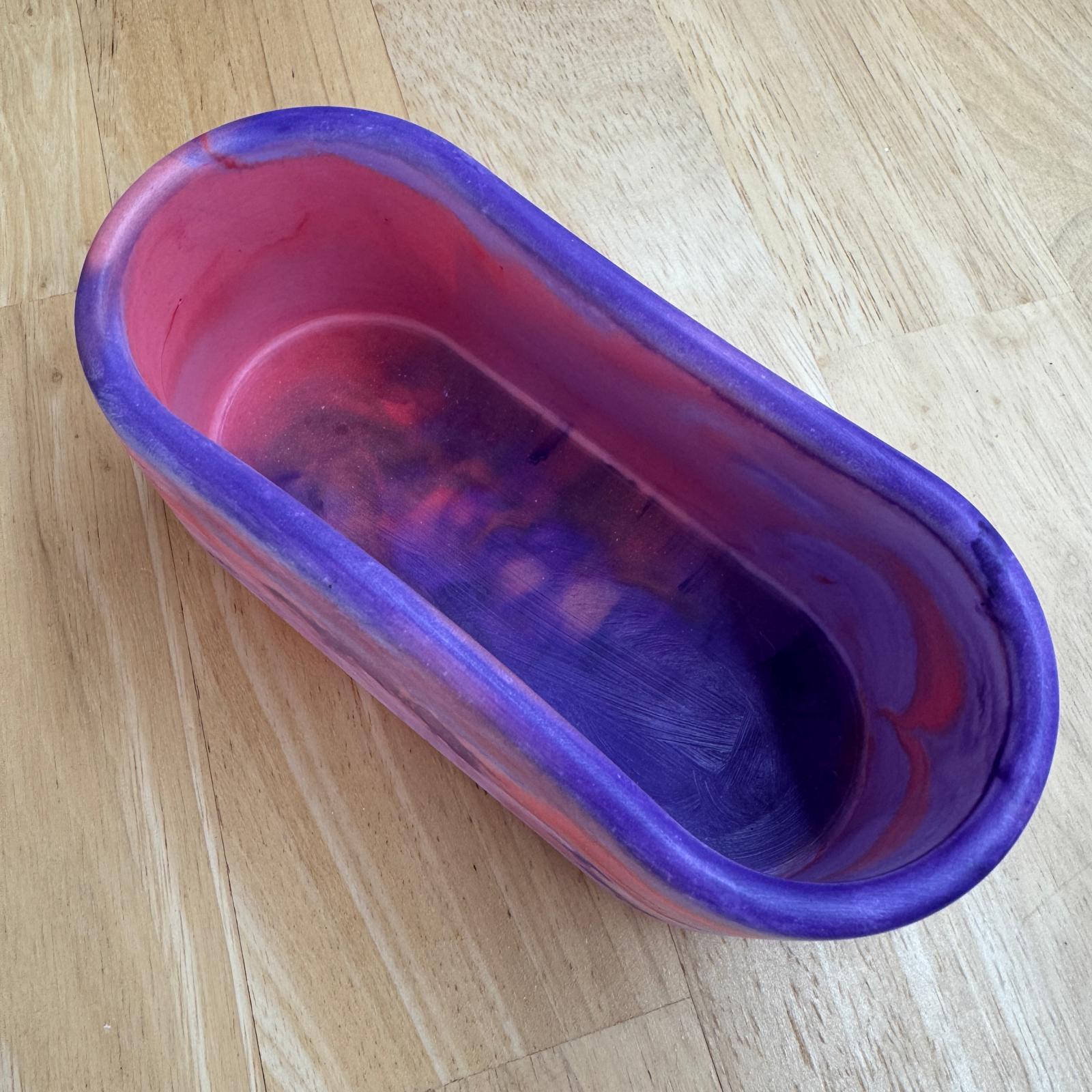Red and purple oval concrete tulip bowl candle with sandalwood