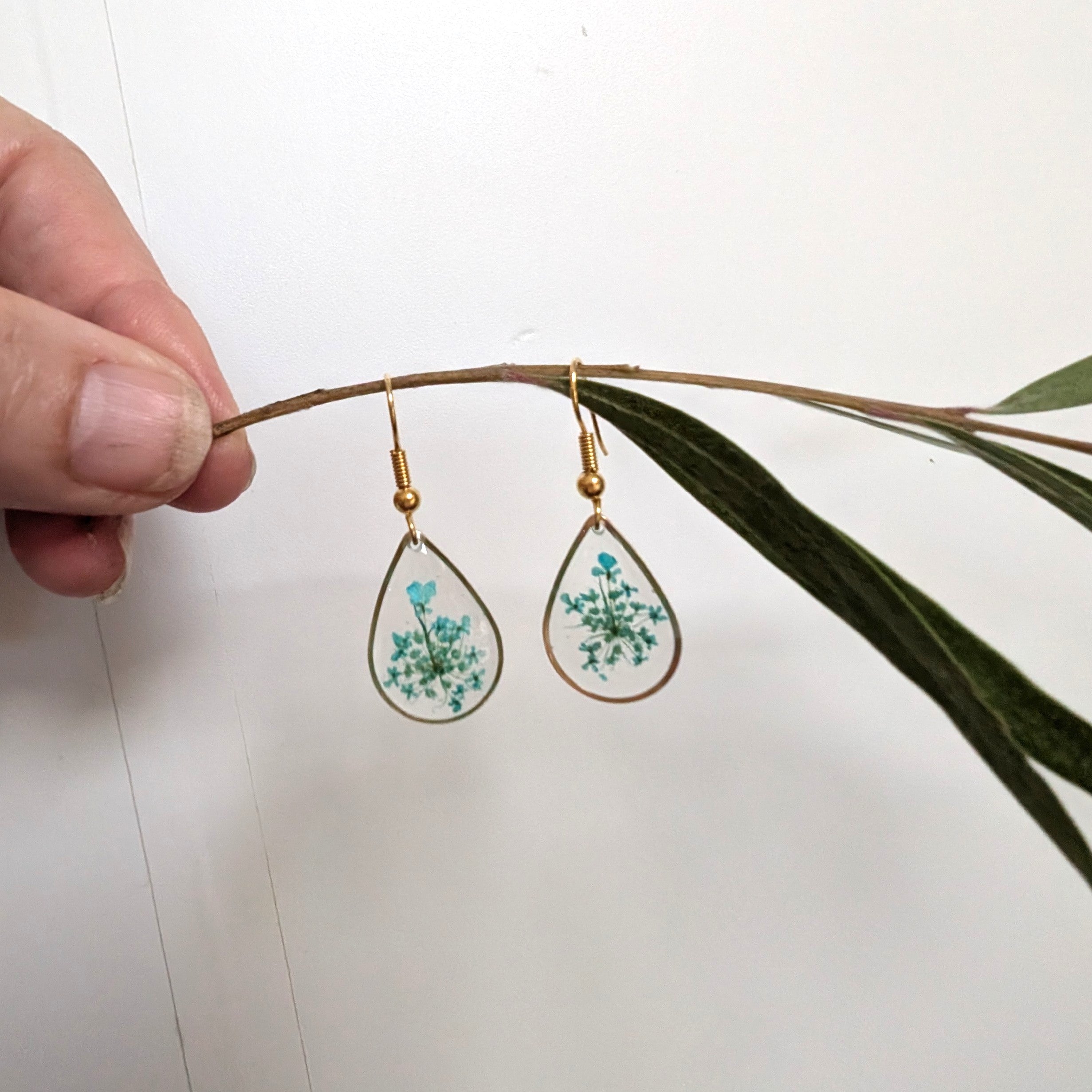 Gold teardrop earrings with teal Queen Anne's Lace