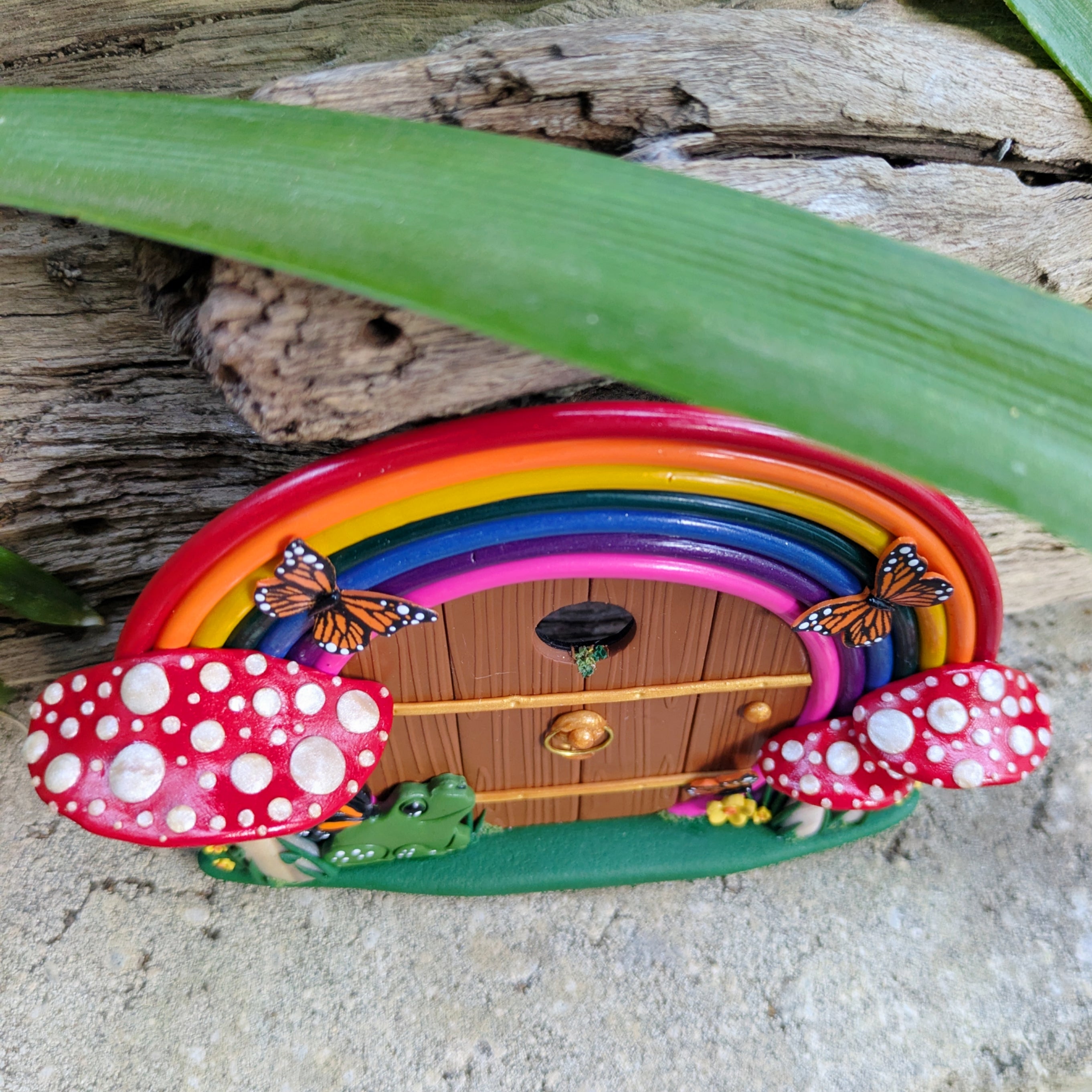 Hand-Sculpted Rainbow Fairy Door with Butterfly-Winged Frog