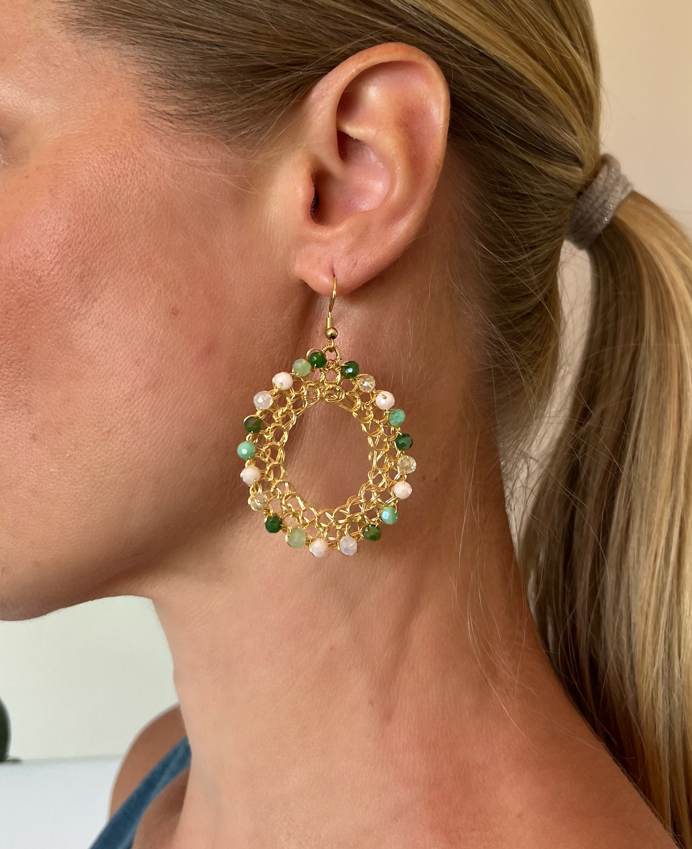 Gold wire hoop earrings, green crystals