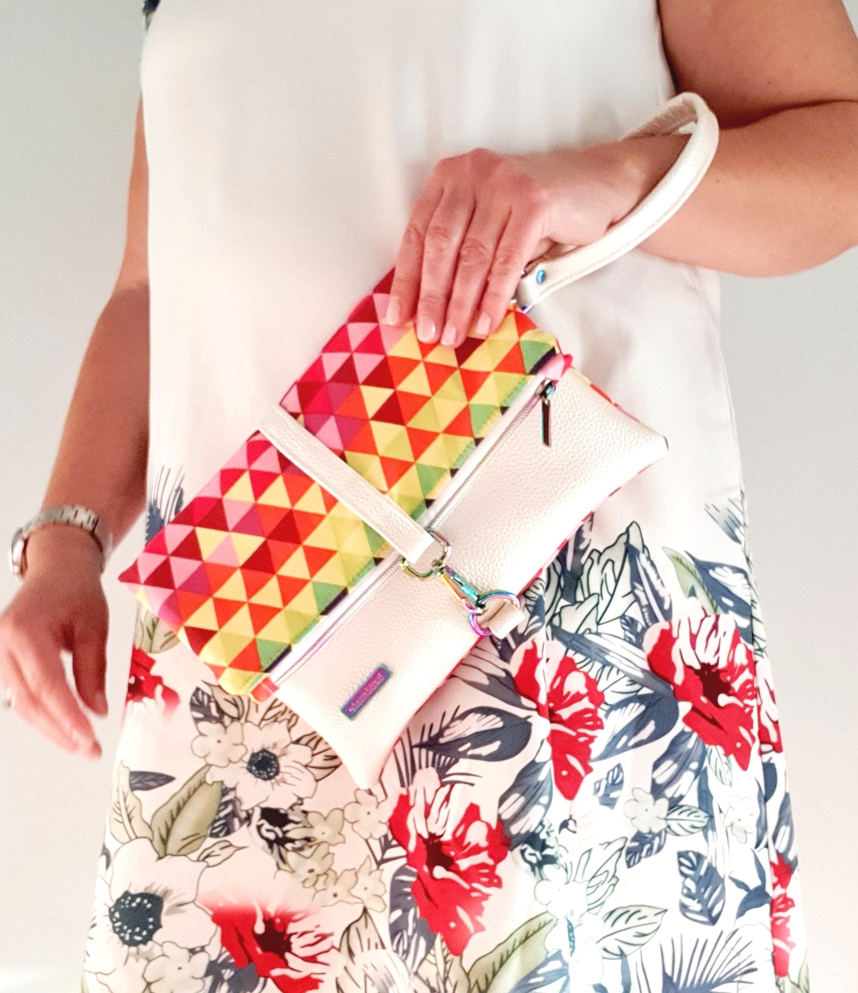 Modern, stylish white leatherette fold over zipper clutch with detachable strap