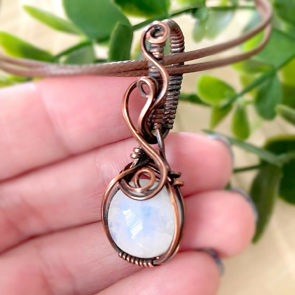 Captivating 47x17mm Wire-Wrapped Rainbow Moonstone Pendant