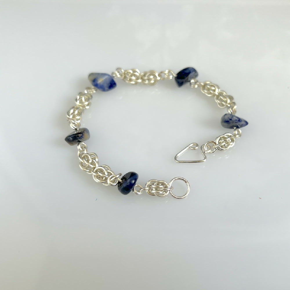 Silver plated sweet pea sodalite bracelet hand