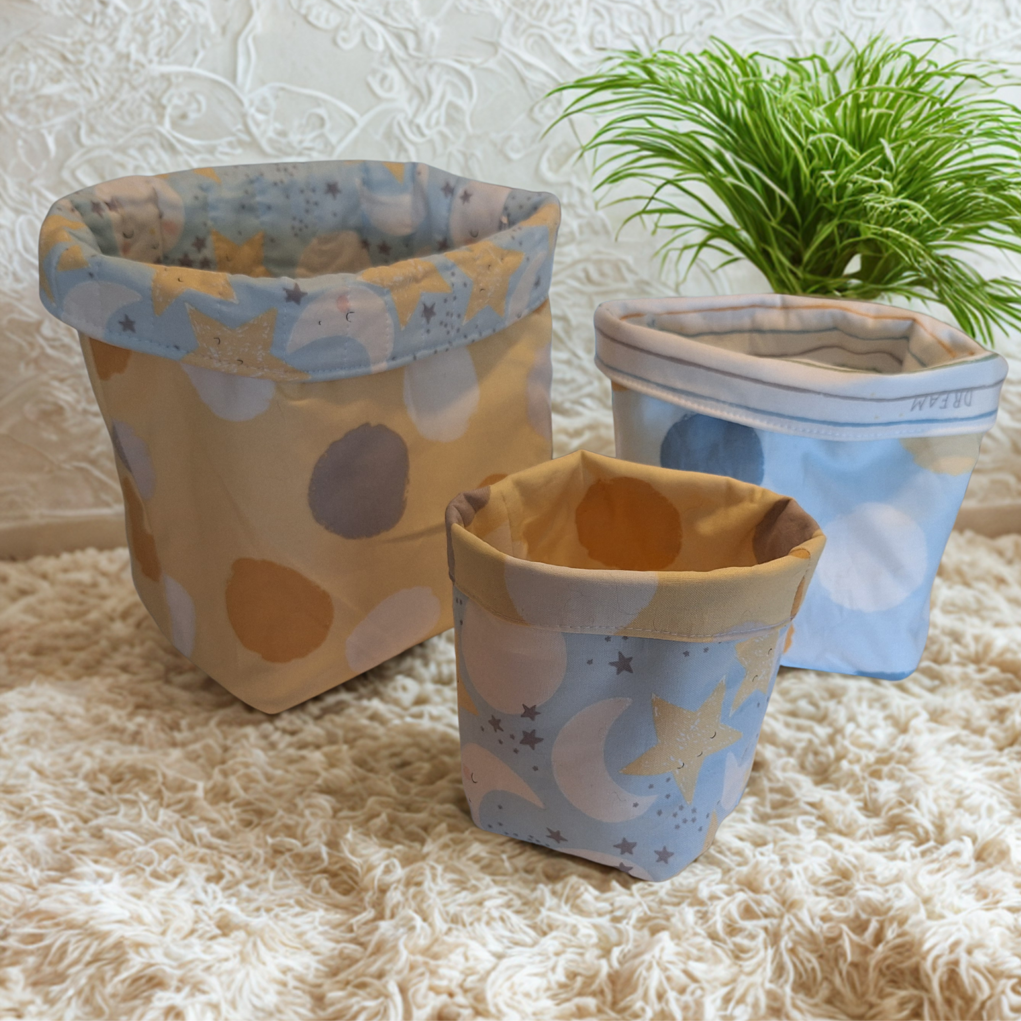 Reversible handmade nesting fabric baskets for baby's room