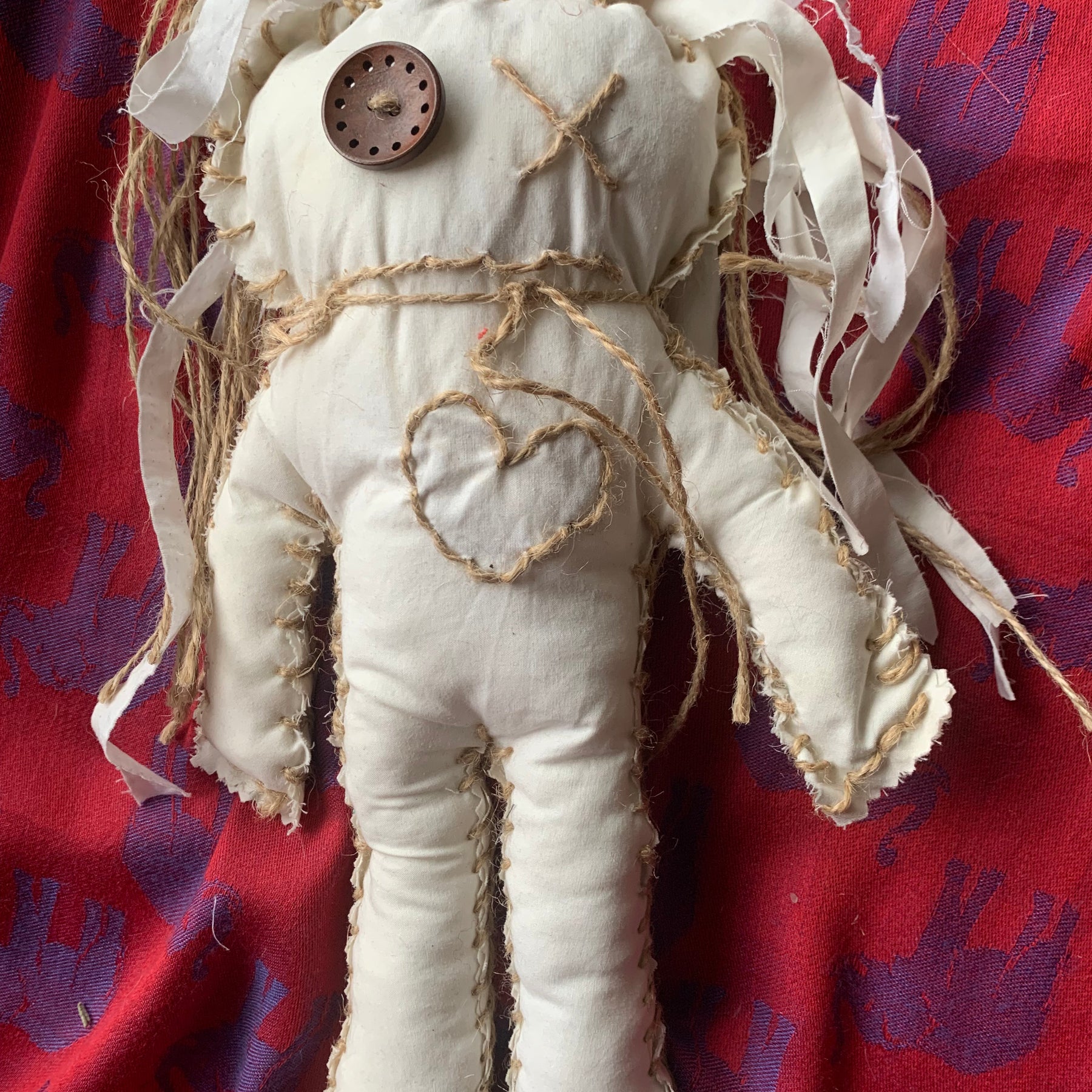 Doll hand made with calico and string