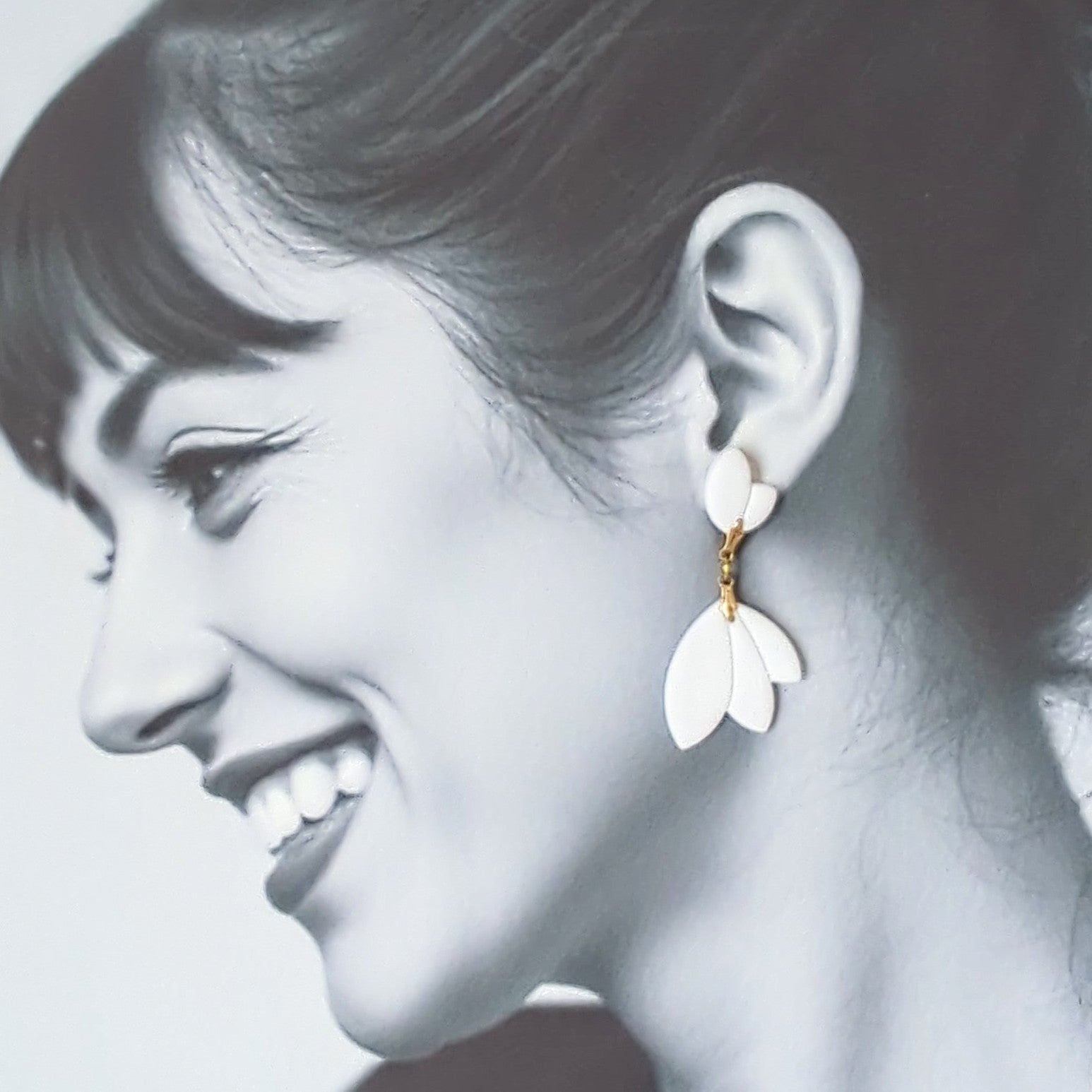 White Earrings With Gold Findings in Different Designs.