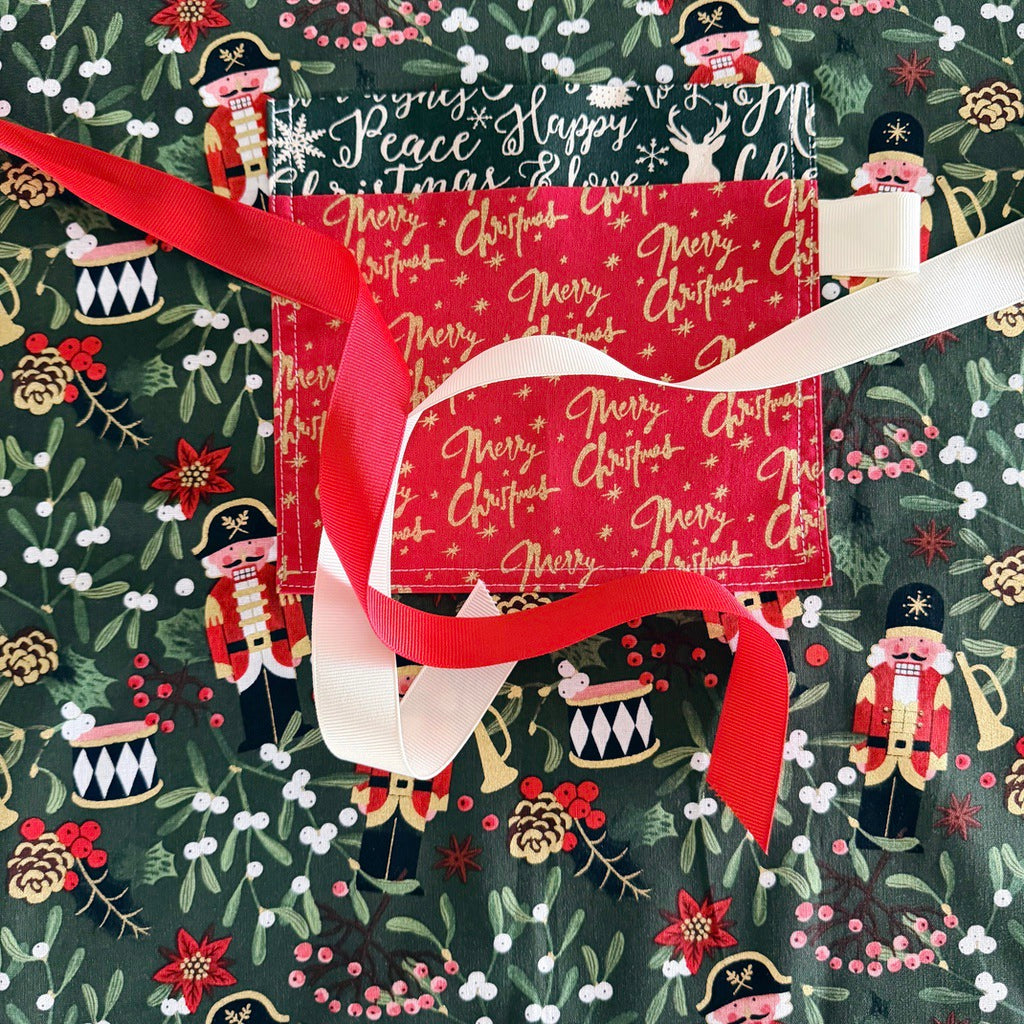 Nutcrackers ladies' Christmas tie back apron.