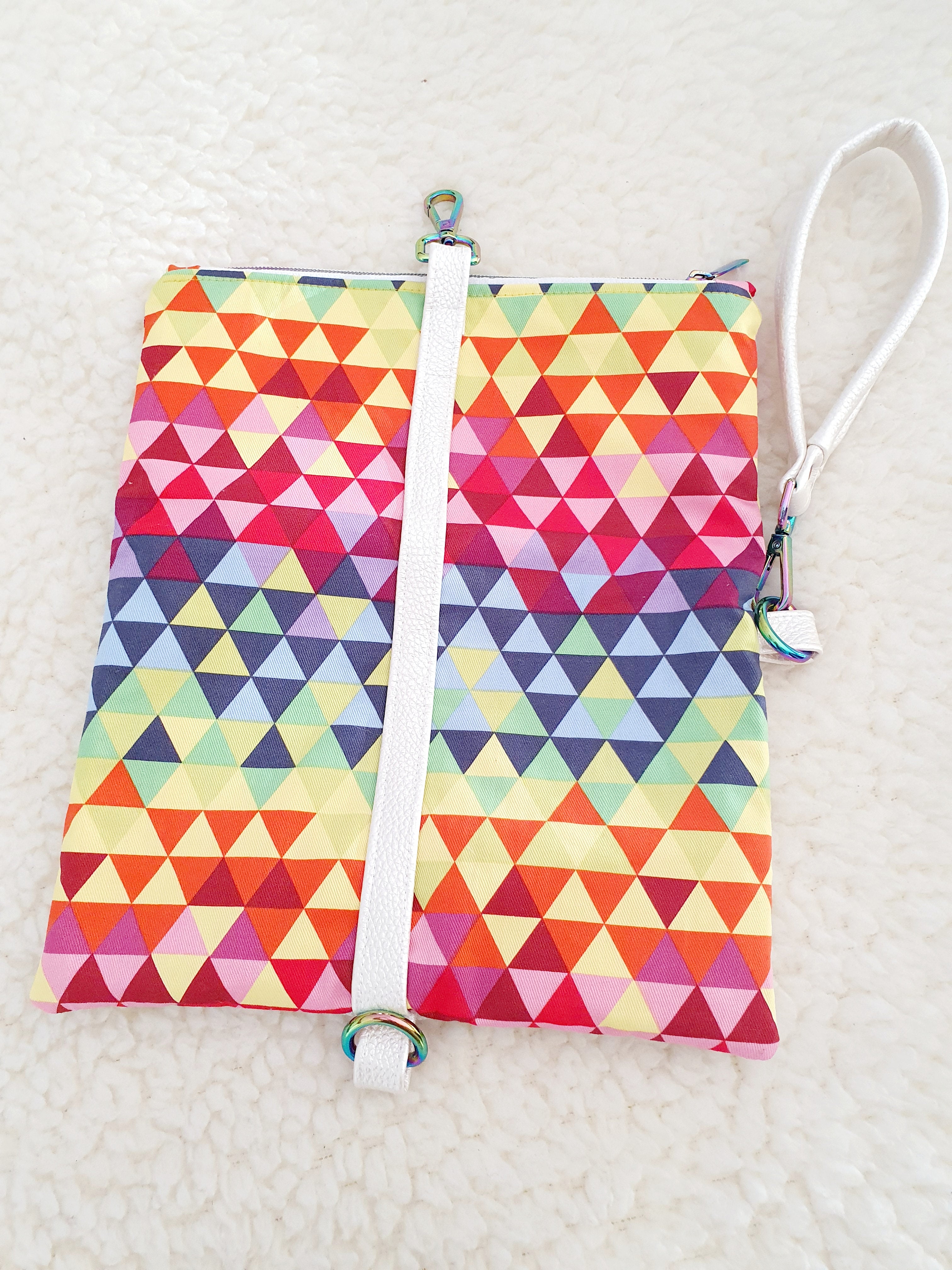 Modern, stylish white leatherette fold over zipper clutch with detachable strap