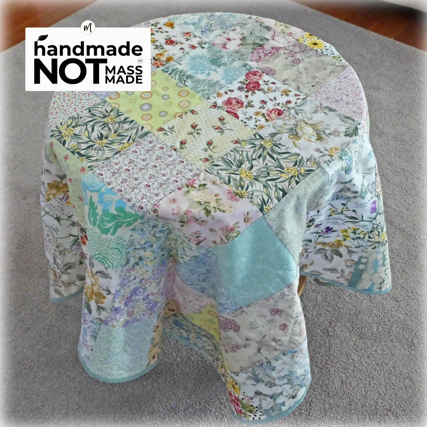 Handmade knee rug with chenille backing. Pretty florals