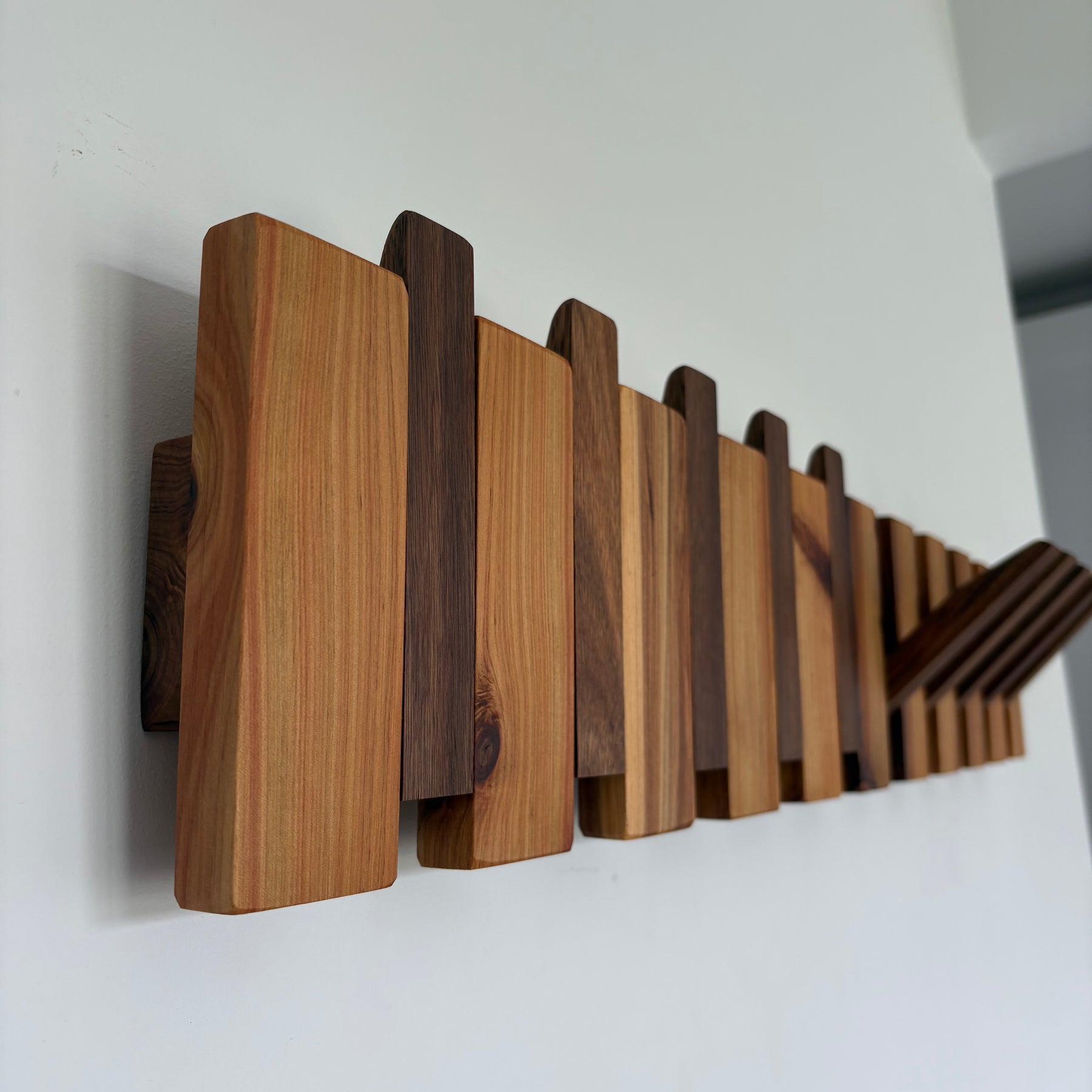 Two tone piano style coatrack