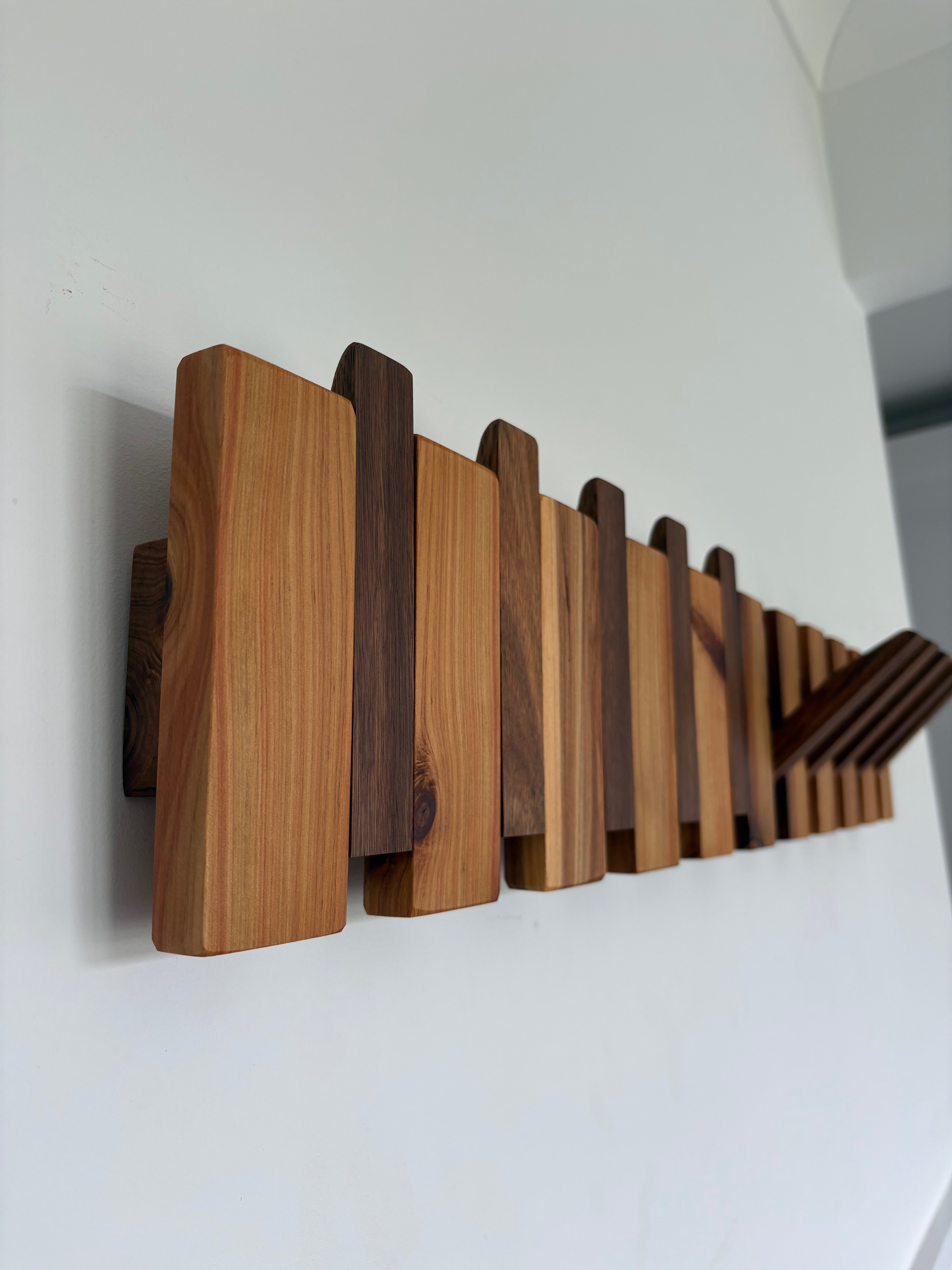 Two tone piano style coatrack