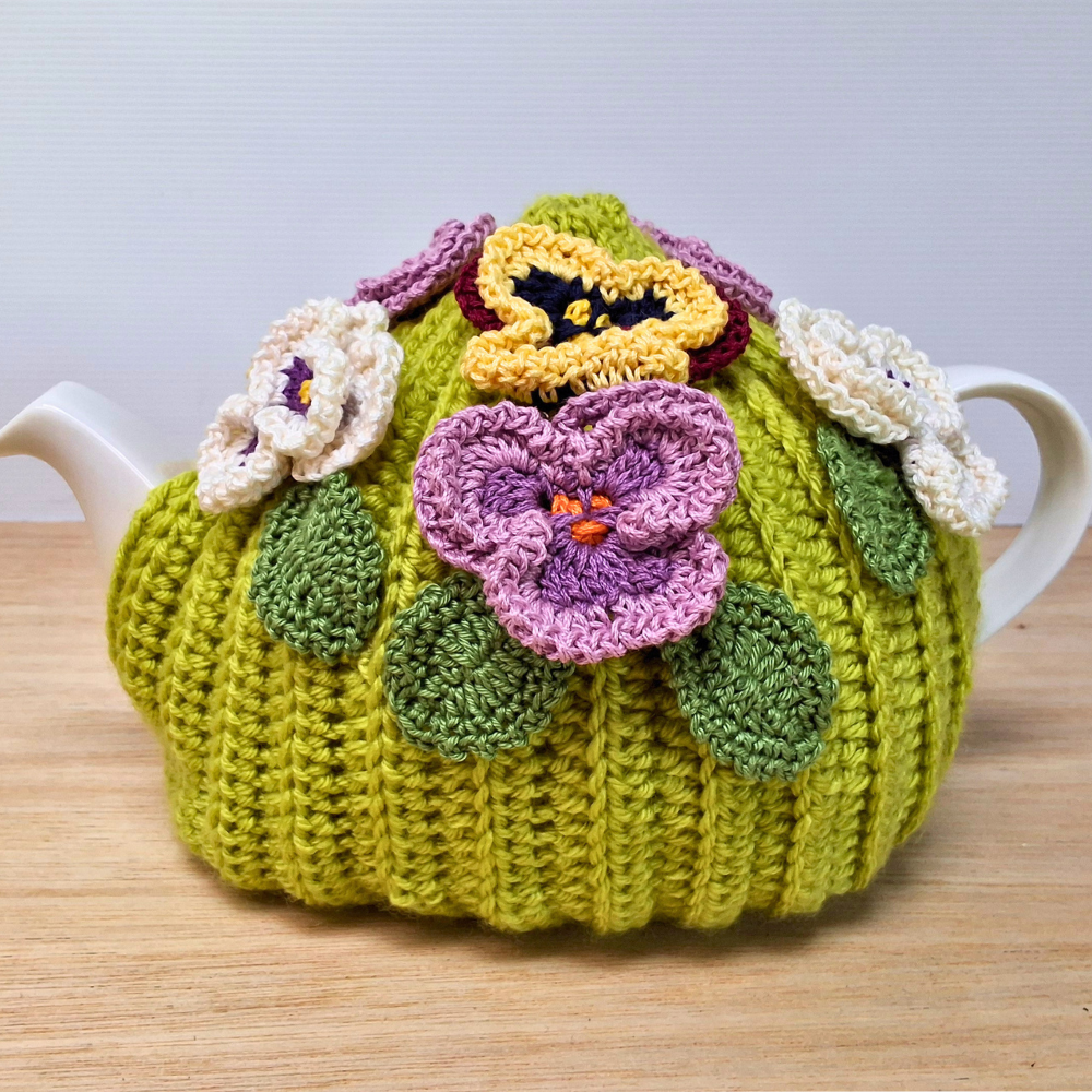 Pansies on green tea cosy for medium teapot
