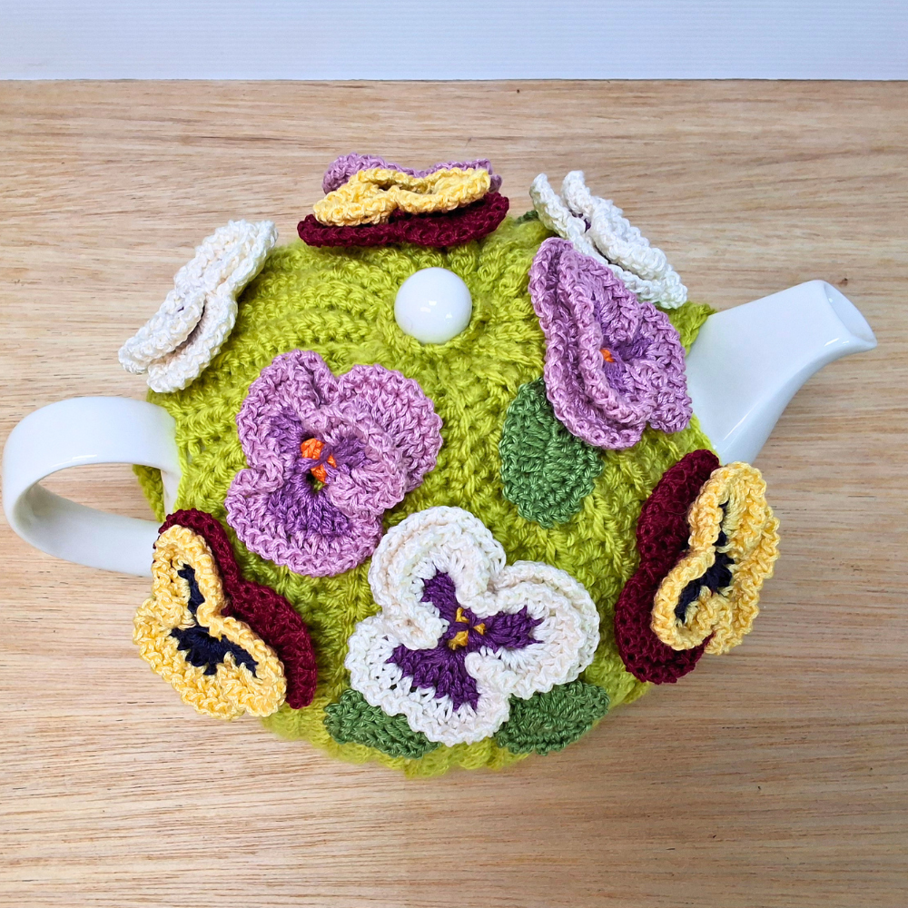 Pansies on green tea cosy for medium teapot