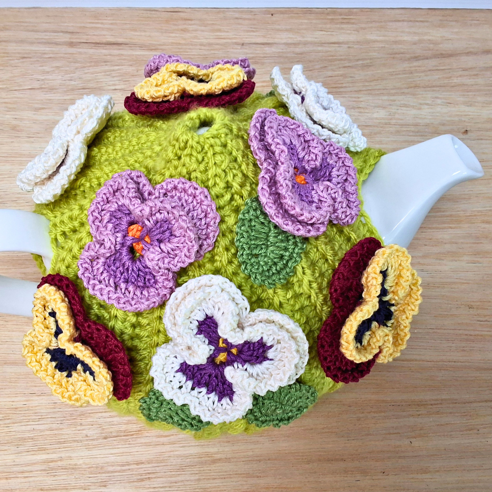 Pansies on green tea cosy for medium teapot