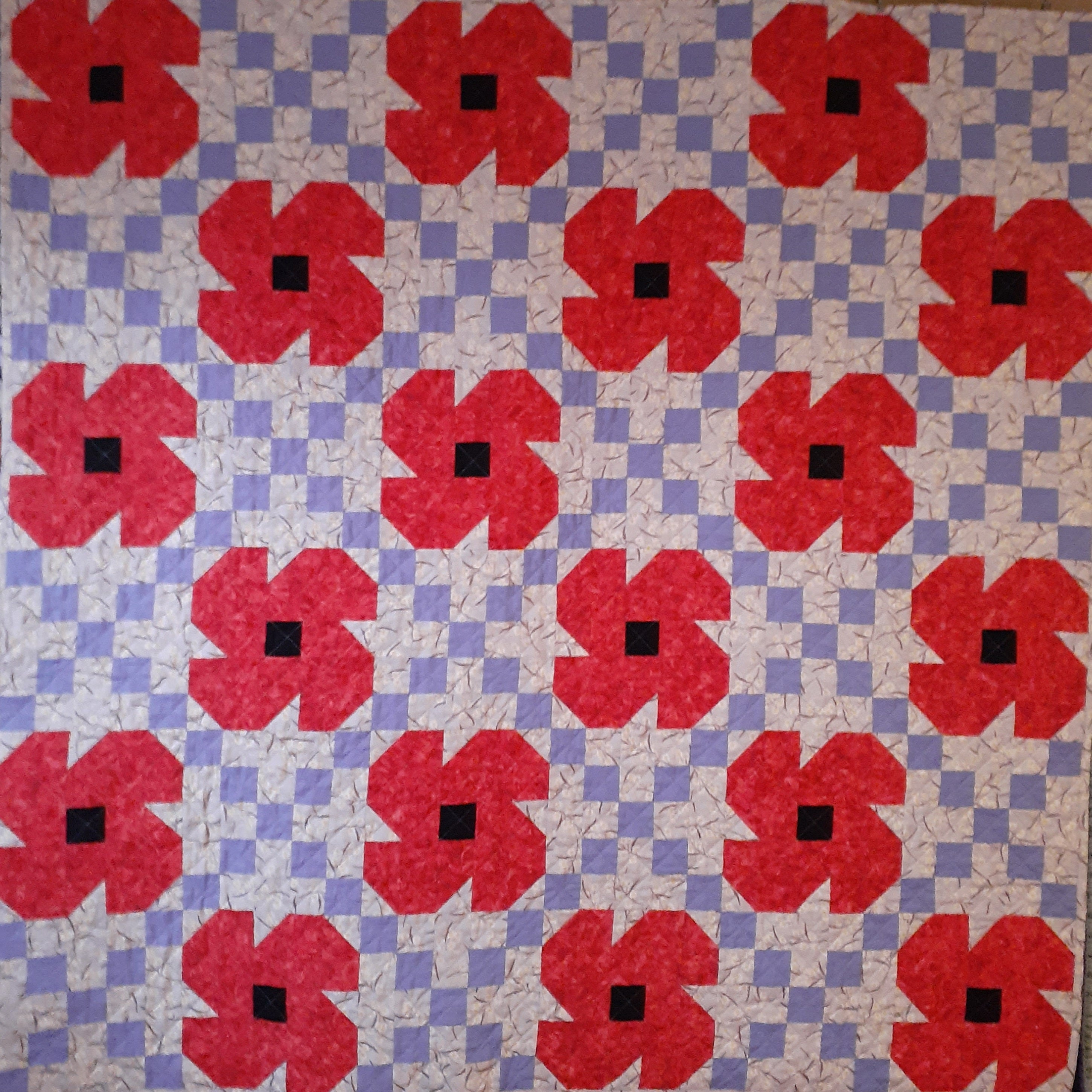 Red poppies Irish chain patchwork quilt