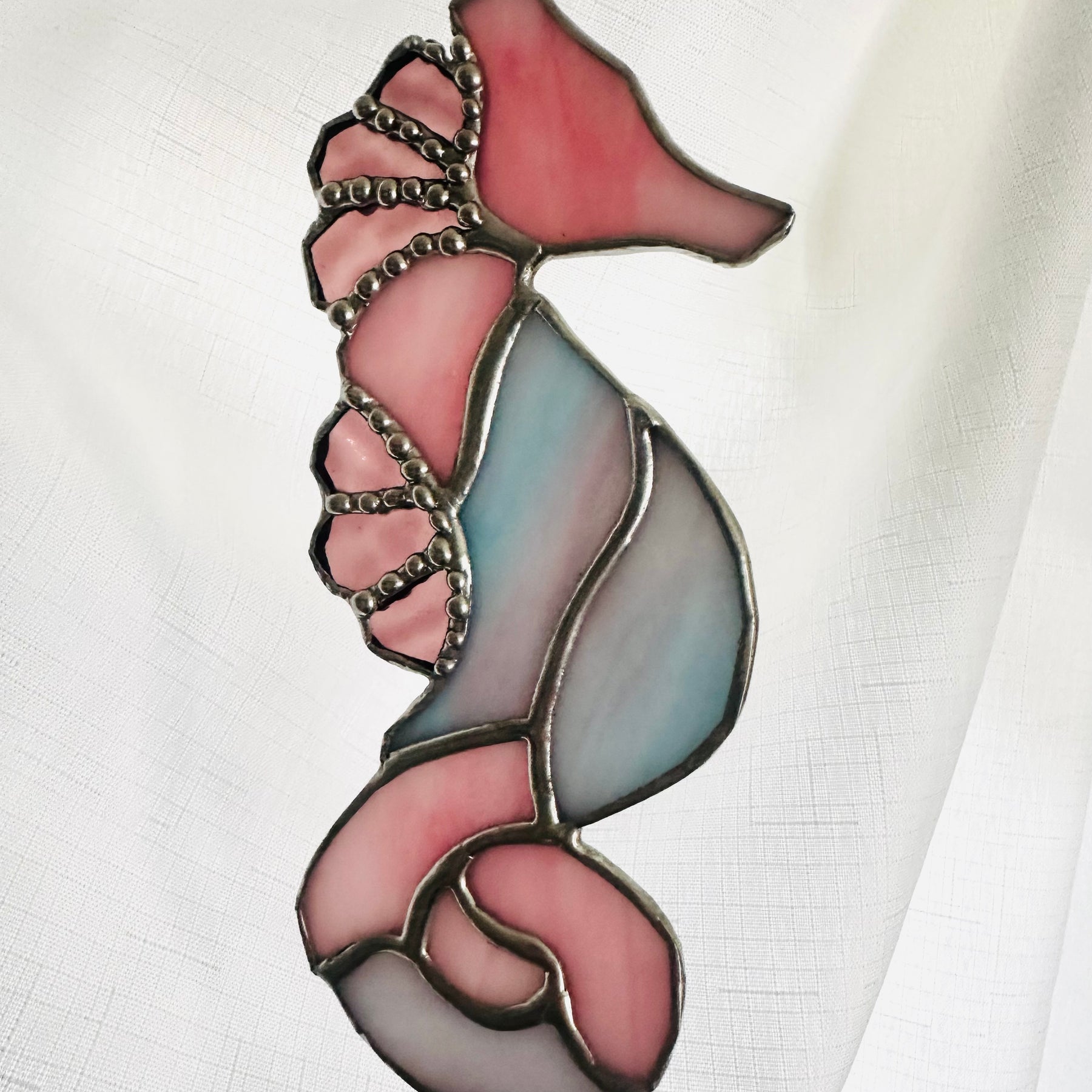 Stained glass seahorse in shades of pink