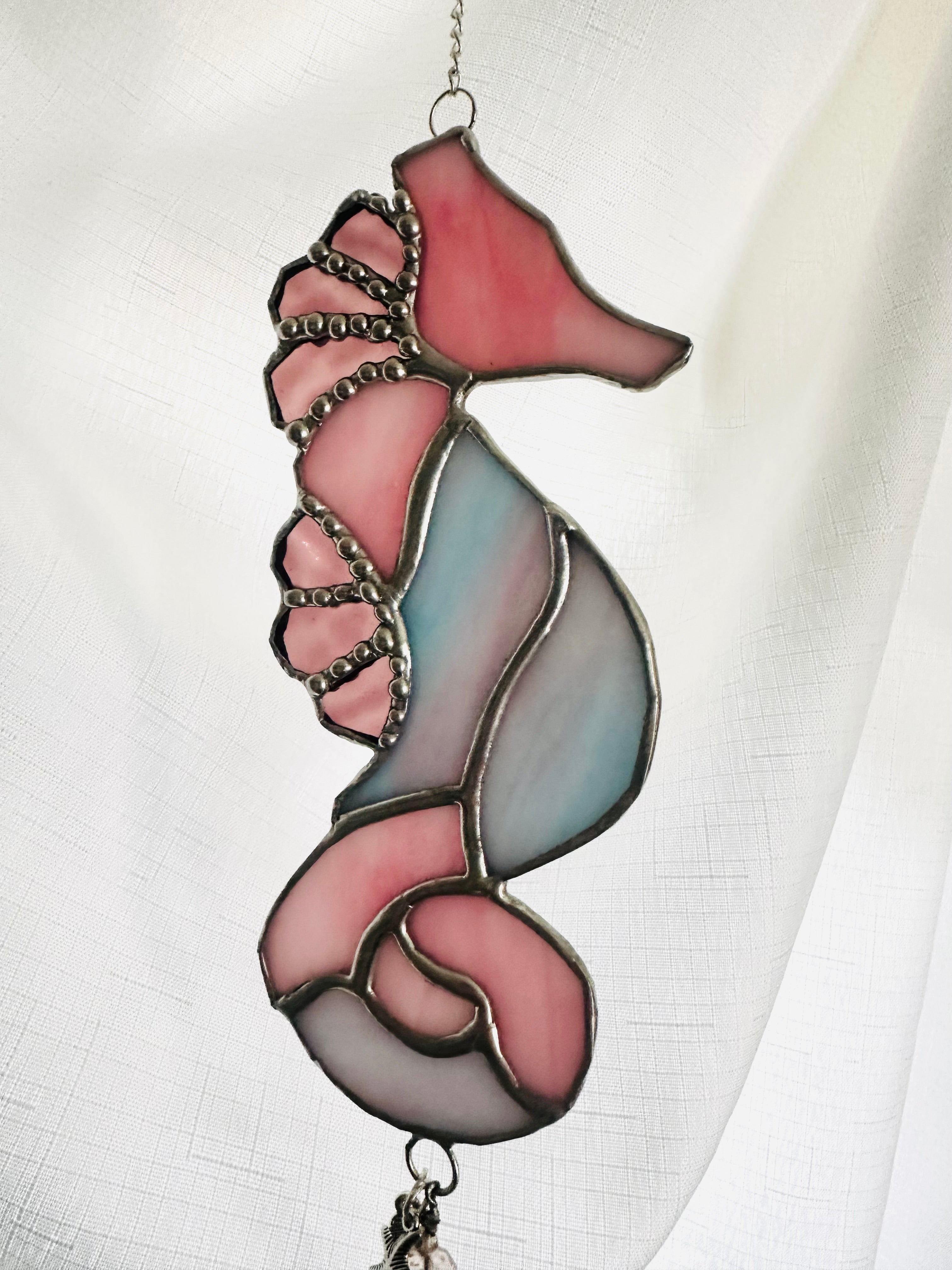 Stained glass seahorse in shades of pink