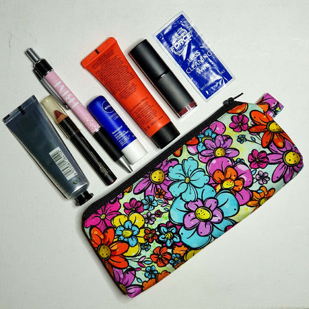 Compact pouch in bright colourful floral fabric, ideal for makeup, stationery, first aid etc