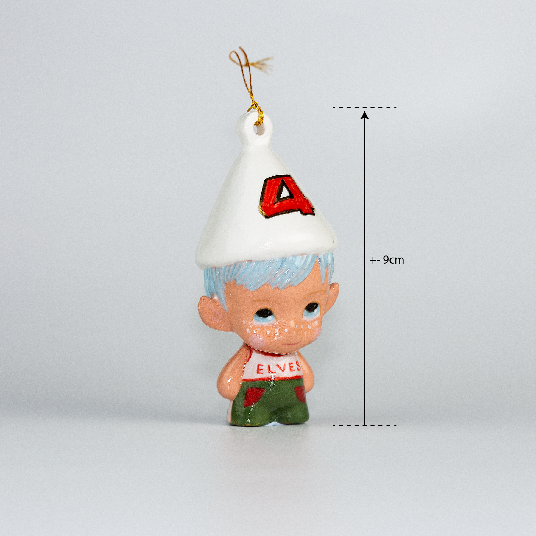Handmade Porcelain Christmas ornament. One-of-a-kind. Kade the footy Elf.
