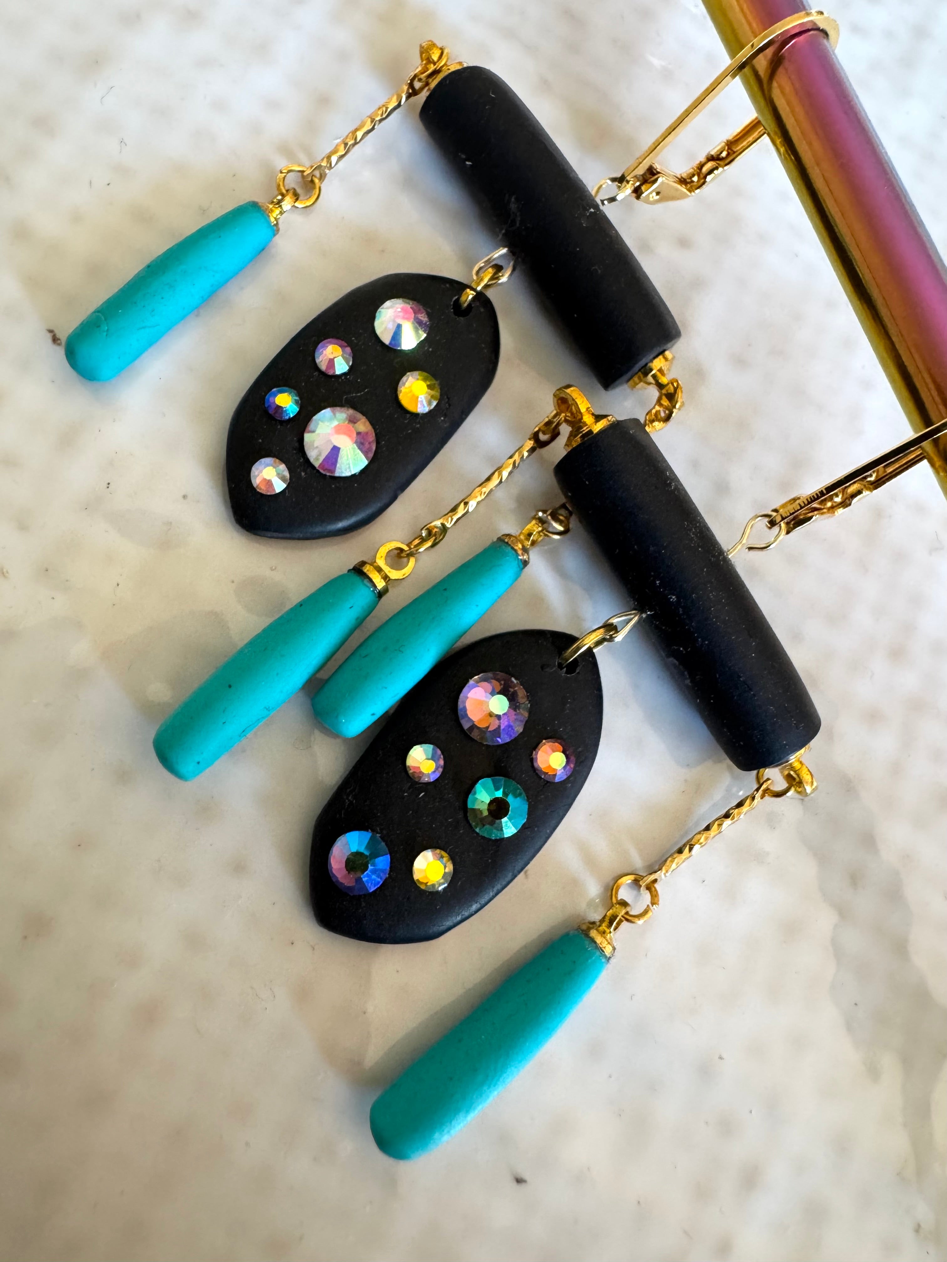 Black rod earrings with holographic gems