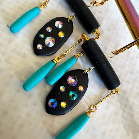 Black rod earrings with holographic gems