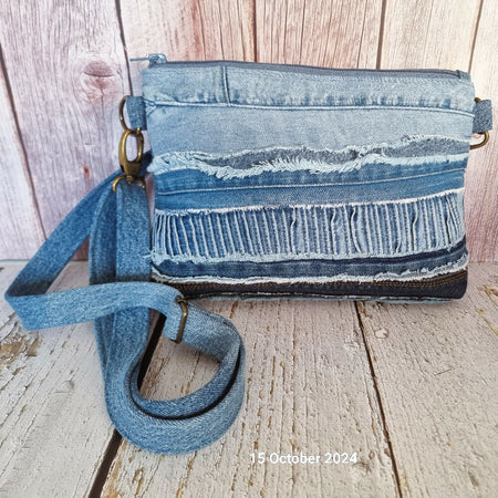 Upcycled patched denim crossbody bag.