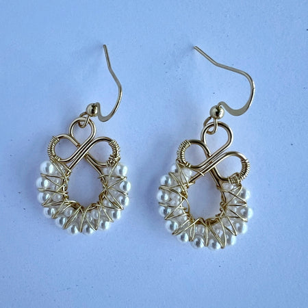 Gold wire wrapped earrings with shell based peals and Czech seee beads