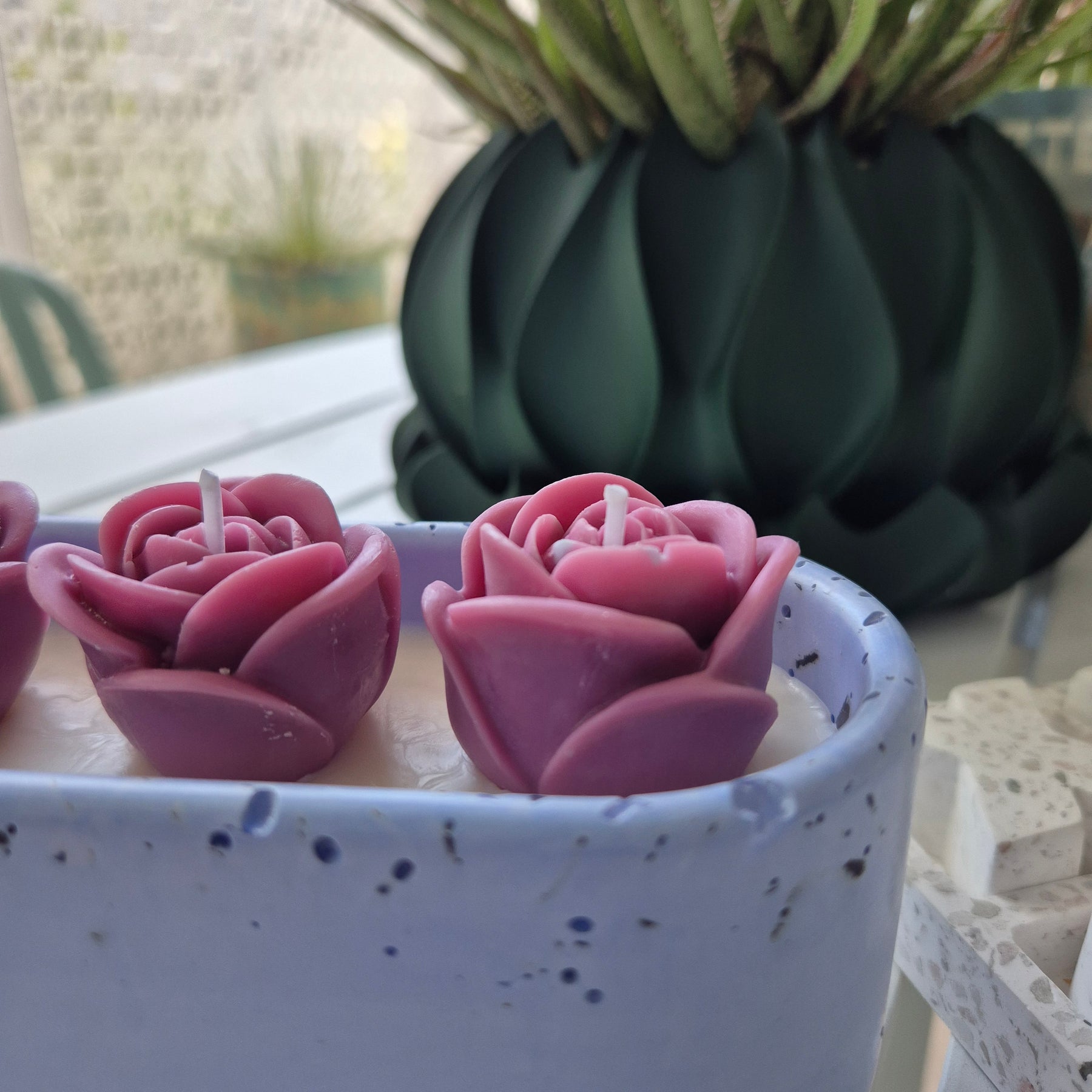 Pale blue concrete bowl candle with quartz stones and roses