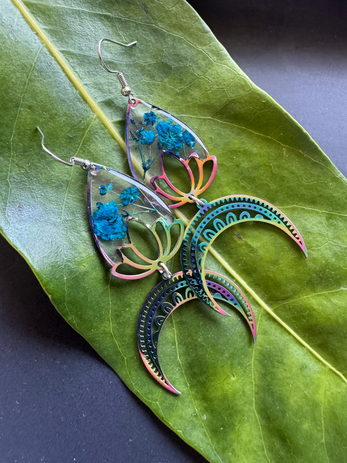 Iridescent rainbow resin earrings with pressed flowers