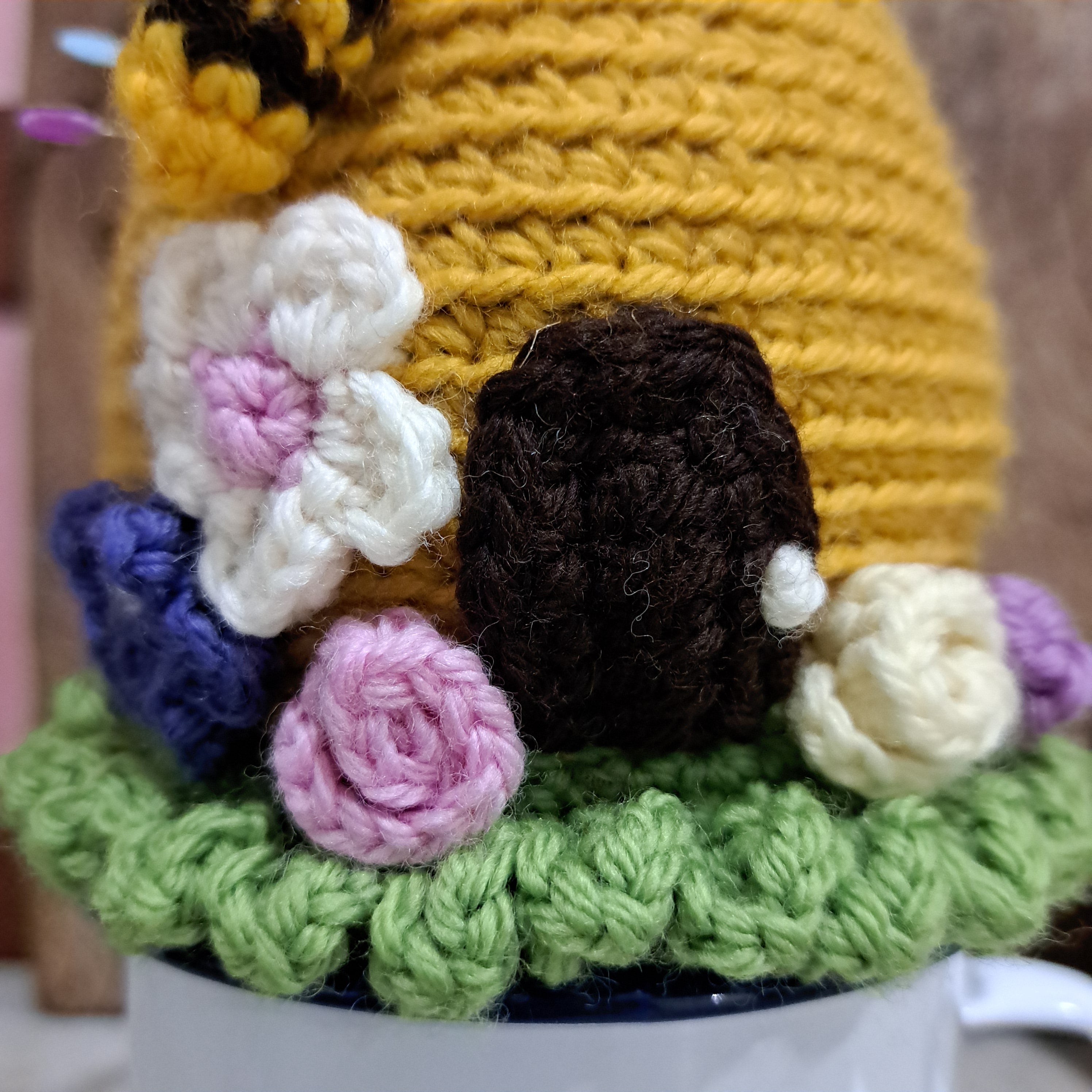 Crochet beehive pin cushion in a sturdy enamel tin mug