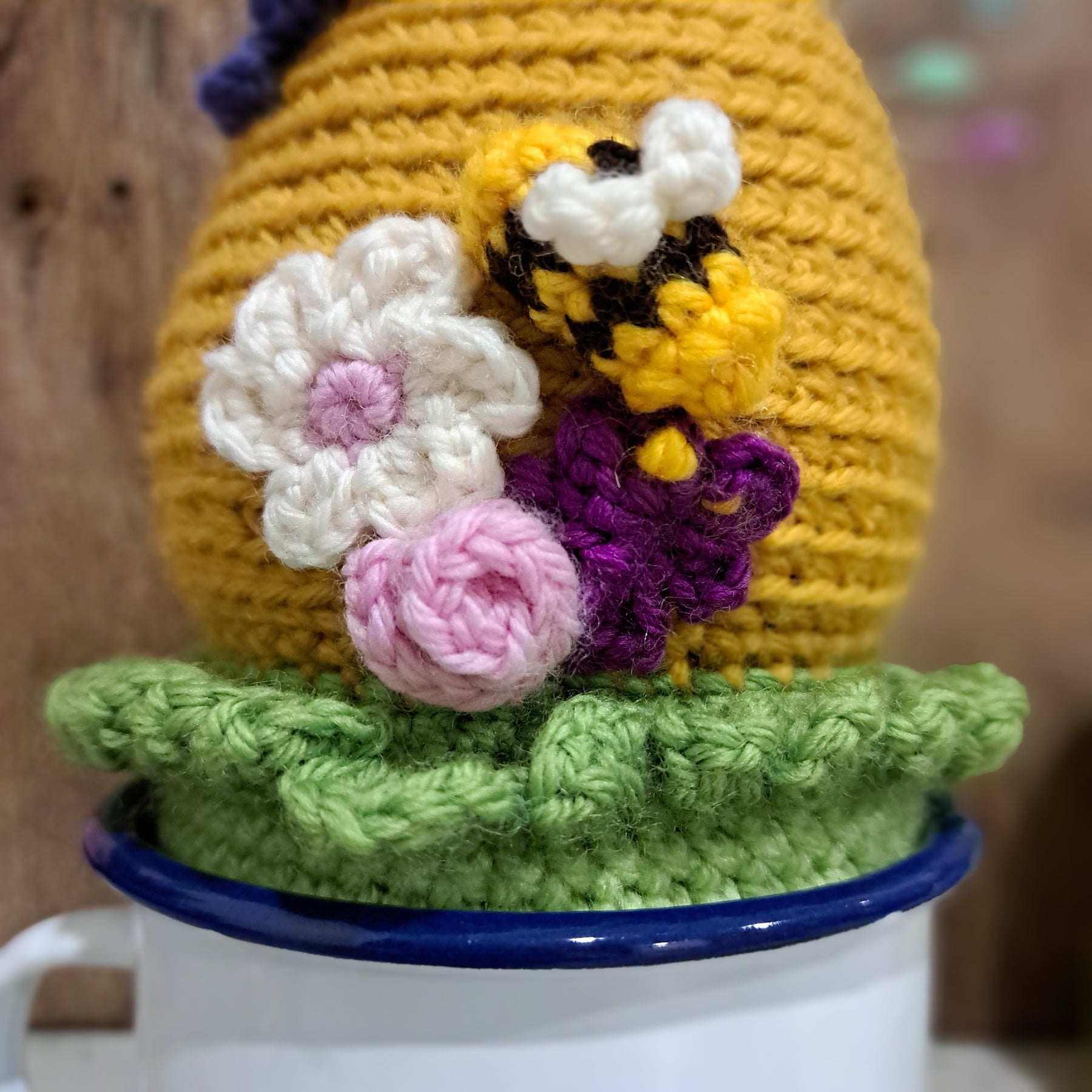 Crochet beehive pin cushion in a sturdy enamel tin mug