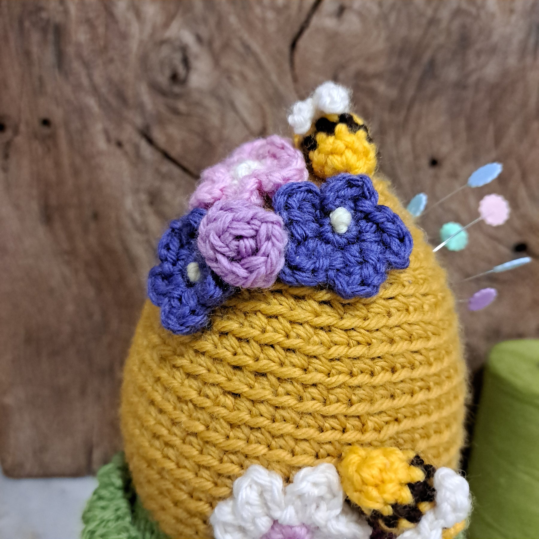 Crochet beehive pin cushion in a sturdy enamel tin mug