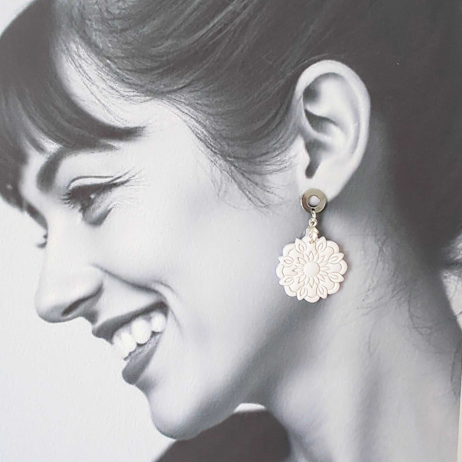 White Earrings with Silver in Different Designs.