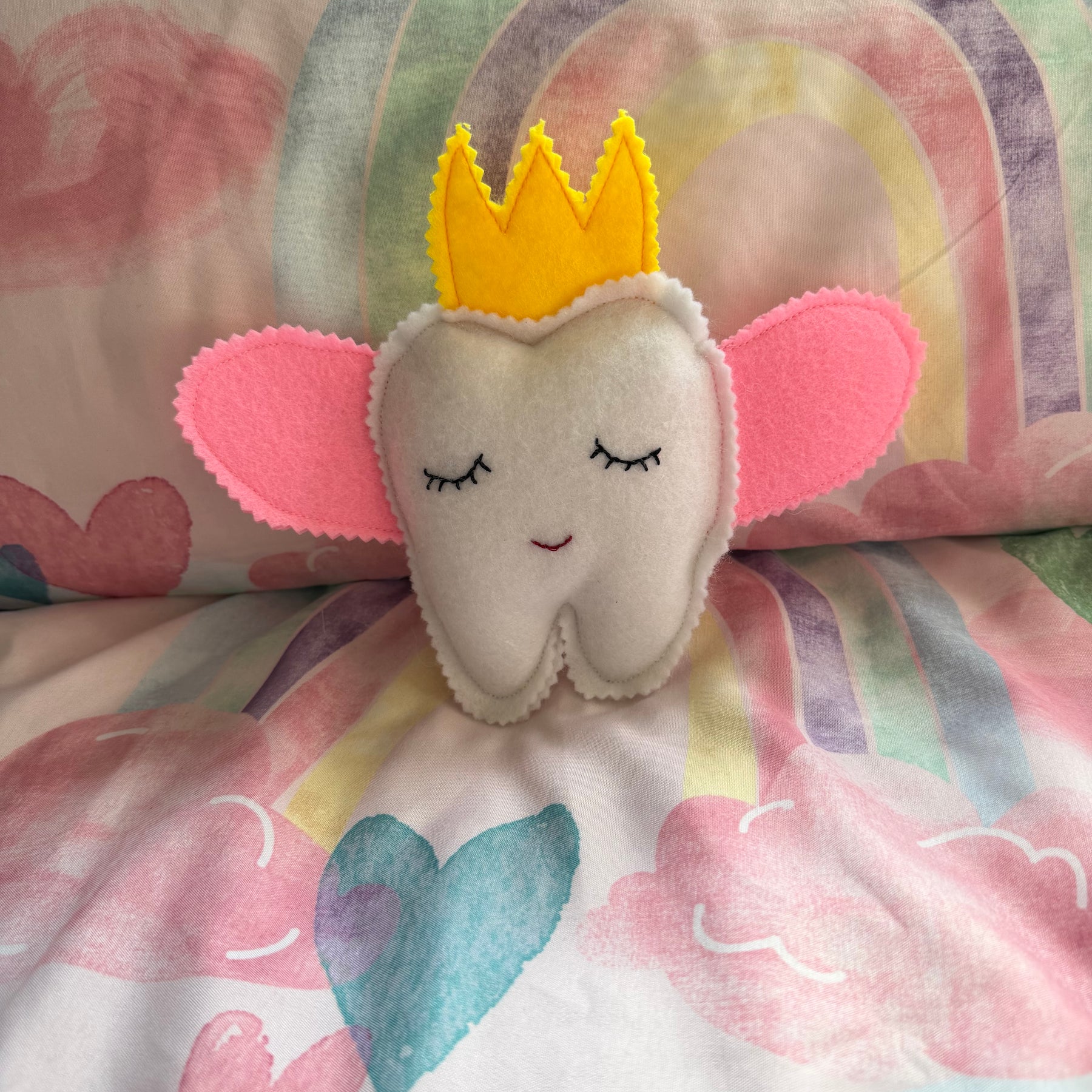 Tooth fairy snuggle toy with tooth pouch
