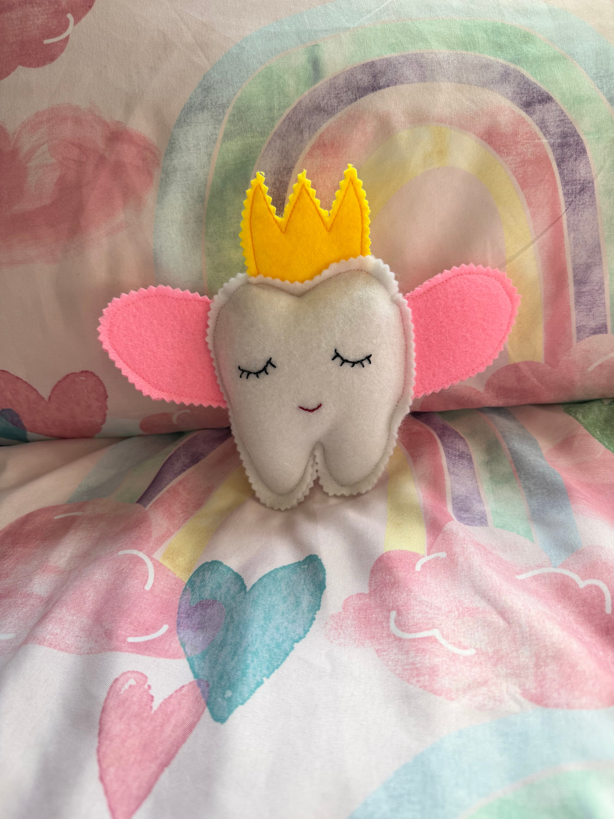 Tooth fairy snuggle toy with tooth pouch