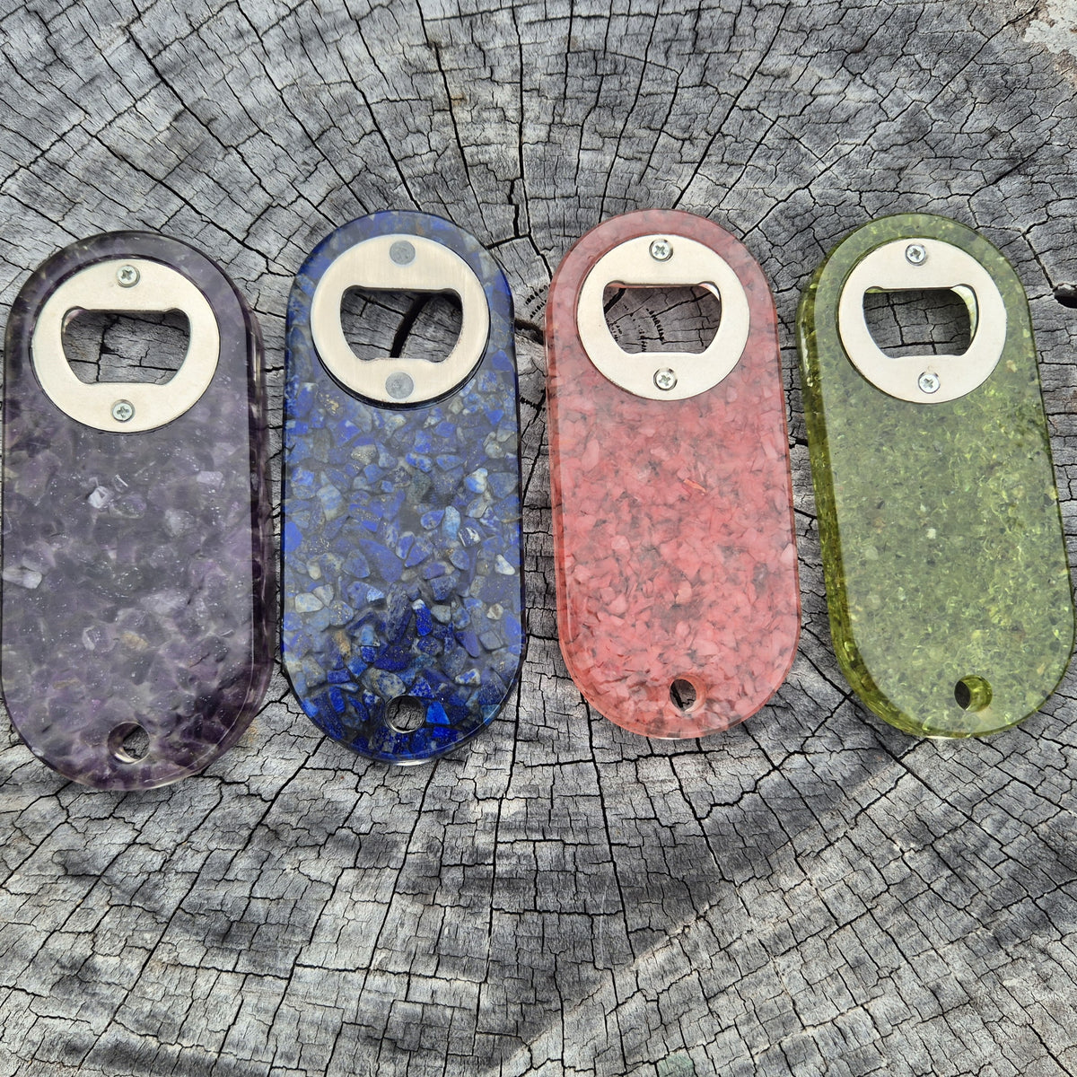 Resin bottle opener with inlaid rose quartz stones