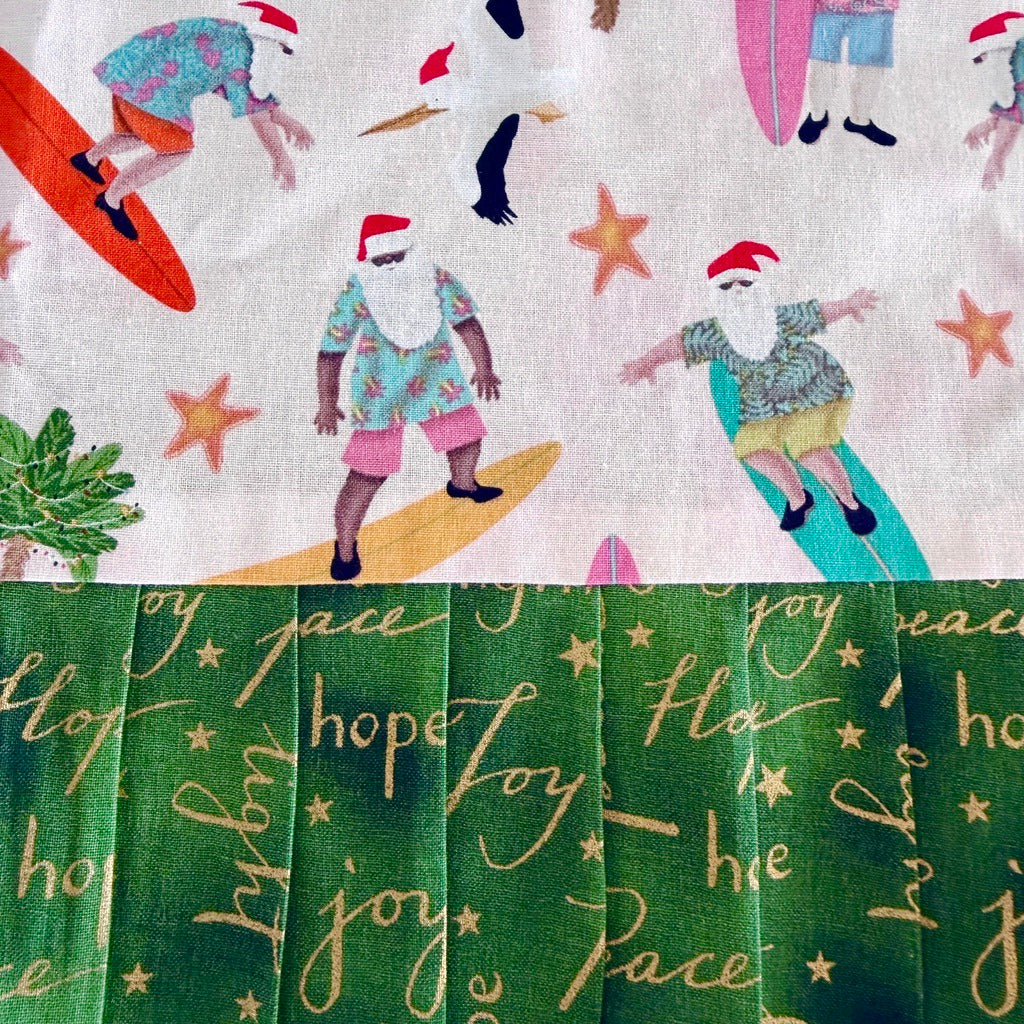 Surfing Santas. Ladies' Christmas tie back apron.