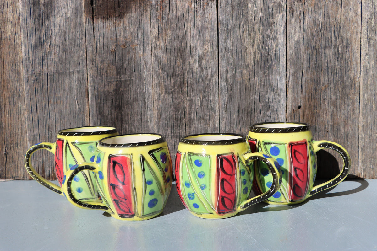 Hand-Painted Mug: Abstract yellow, red, green, black and blue mid-fire stoneware