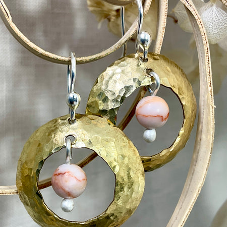 Brass domed earrings with gemstones.