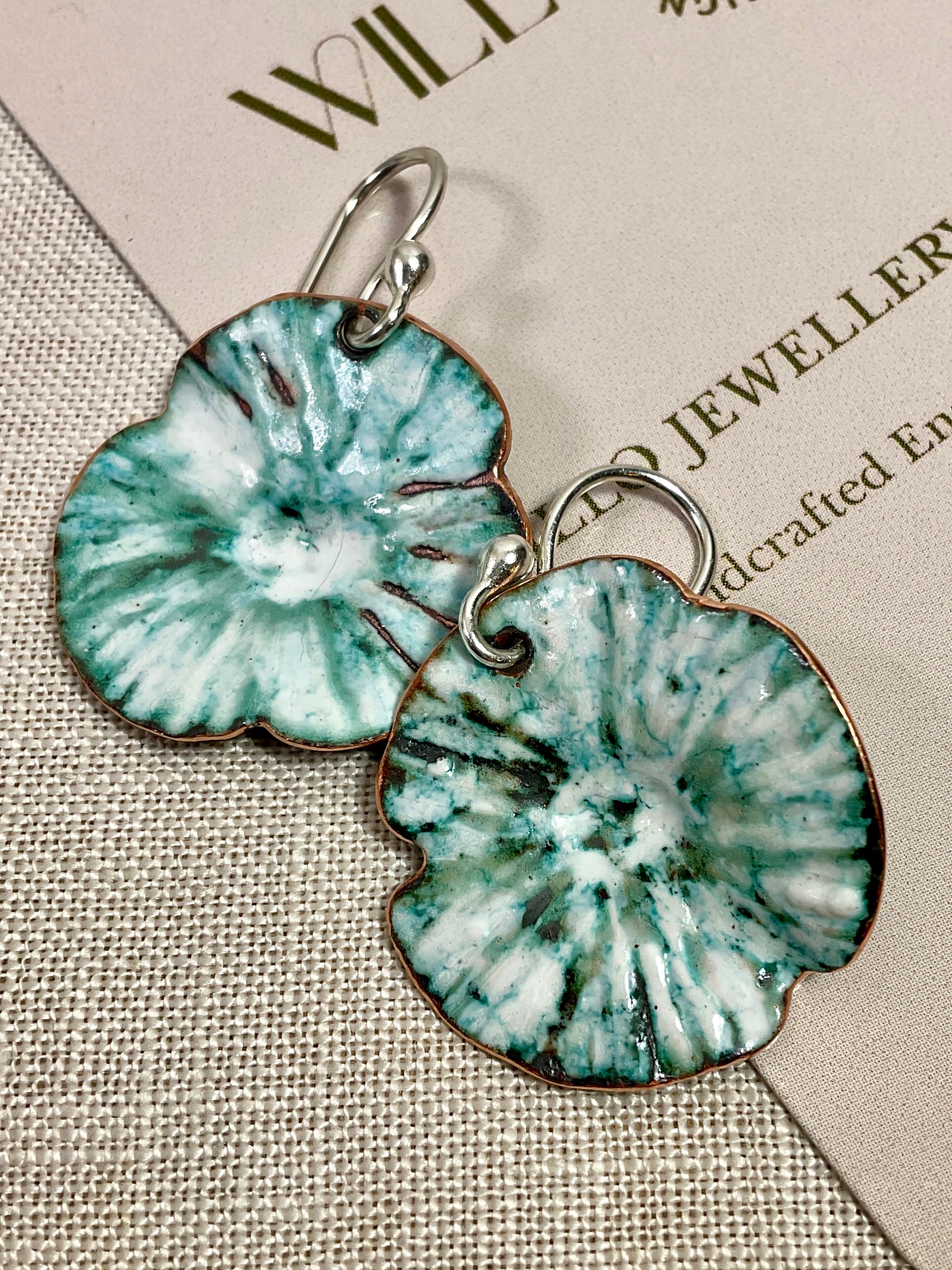 Teal and white flowers. Enamel earrings