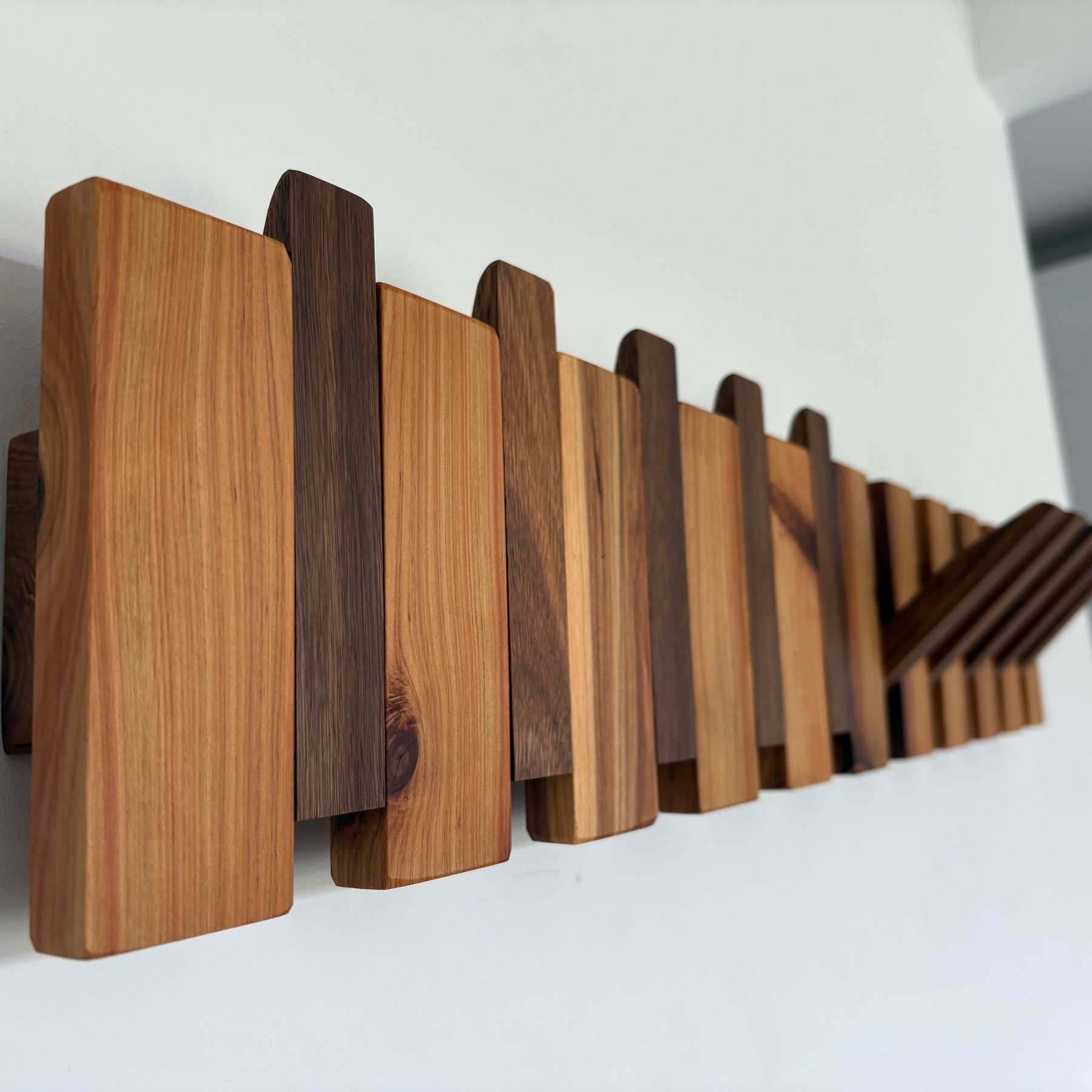 Two tone piano style coatrack