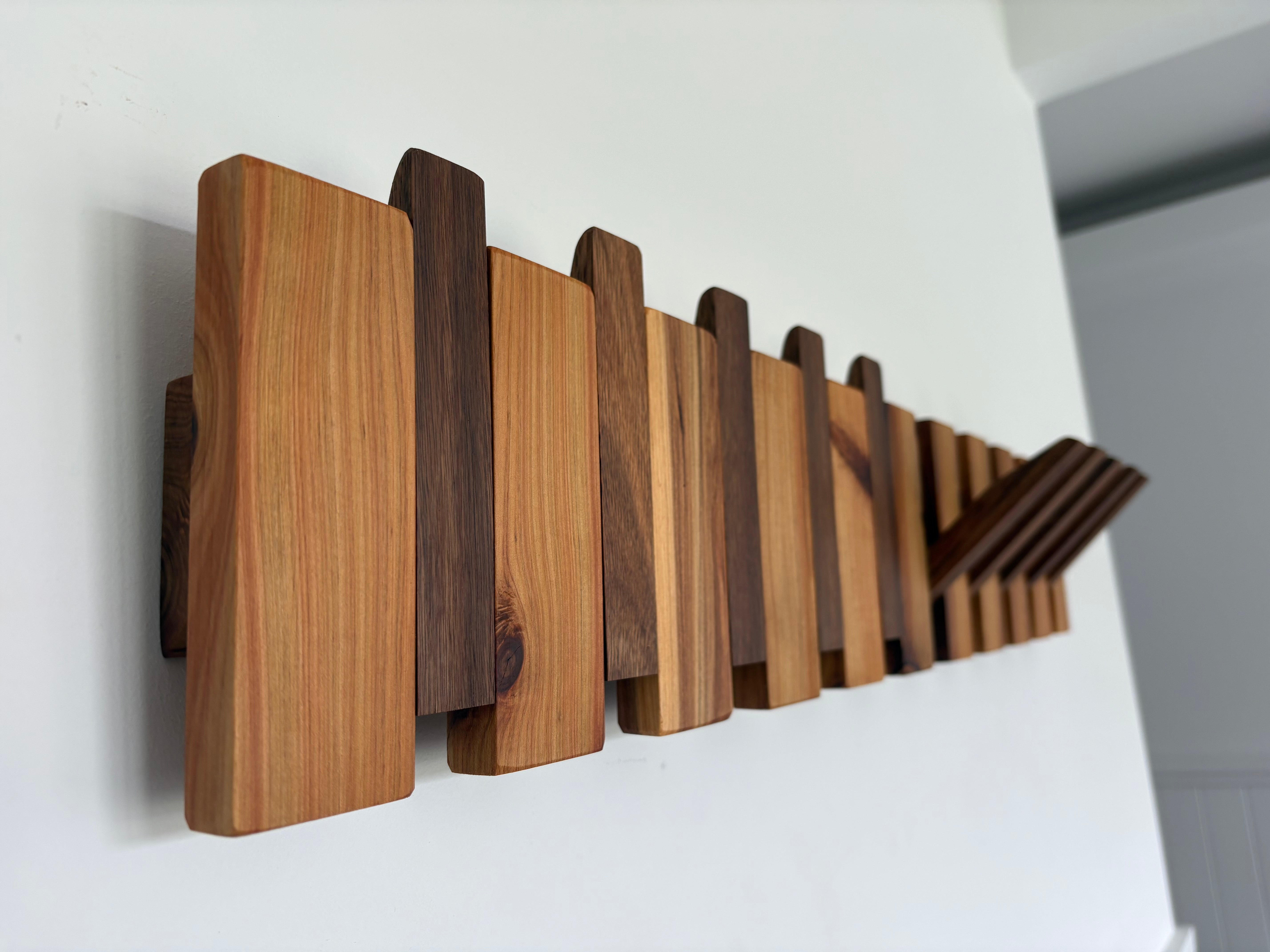 Two tone piano style coatrack
