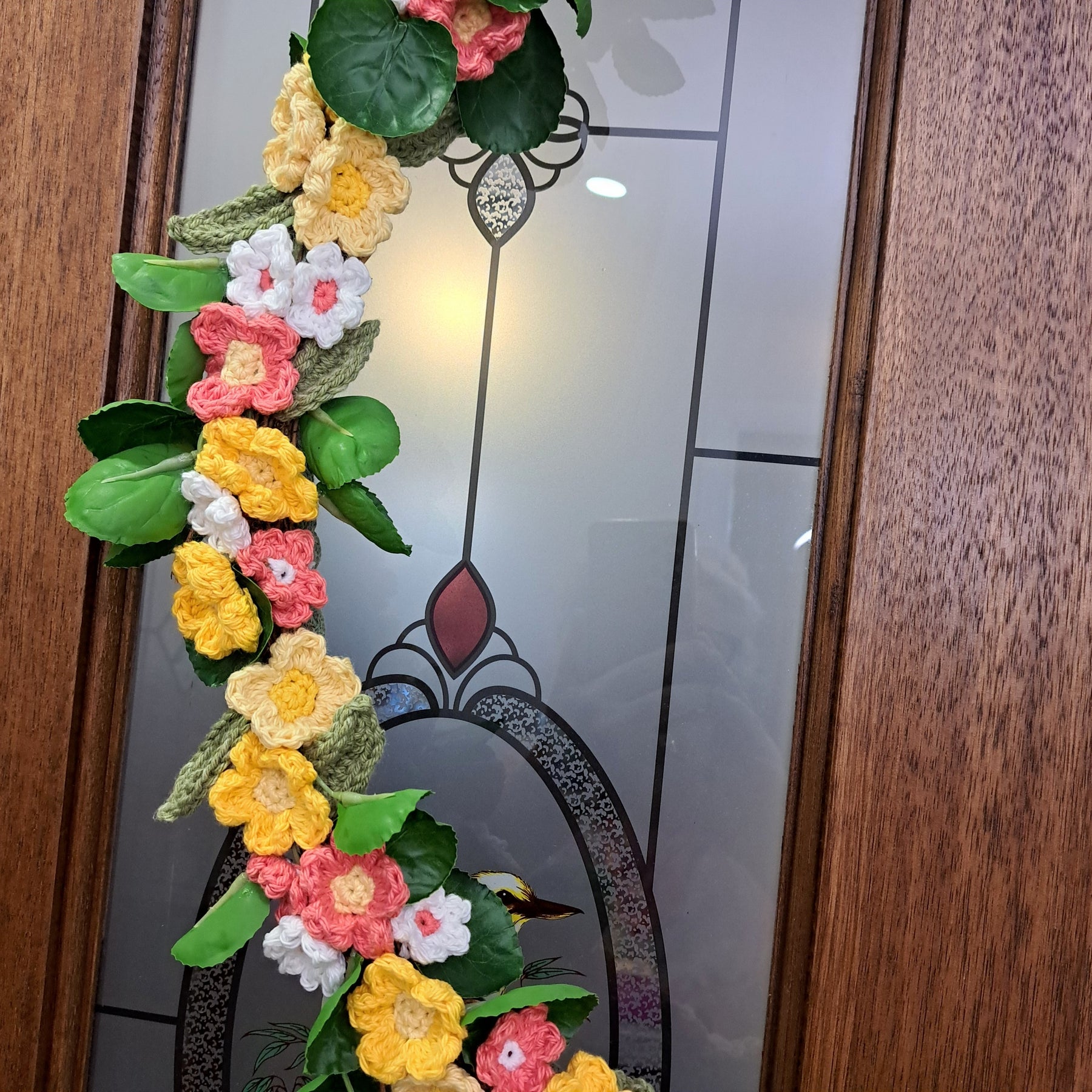 Handmade crochet spring flower wreath, yellows, pinks, white