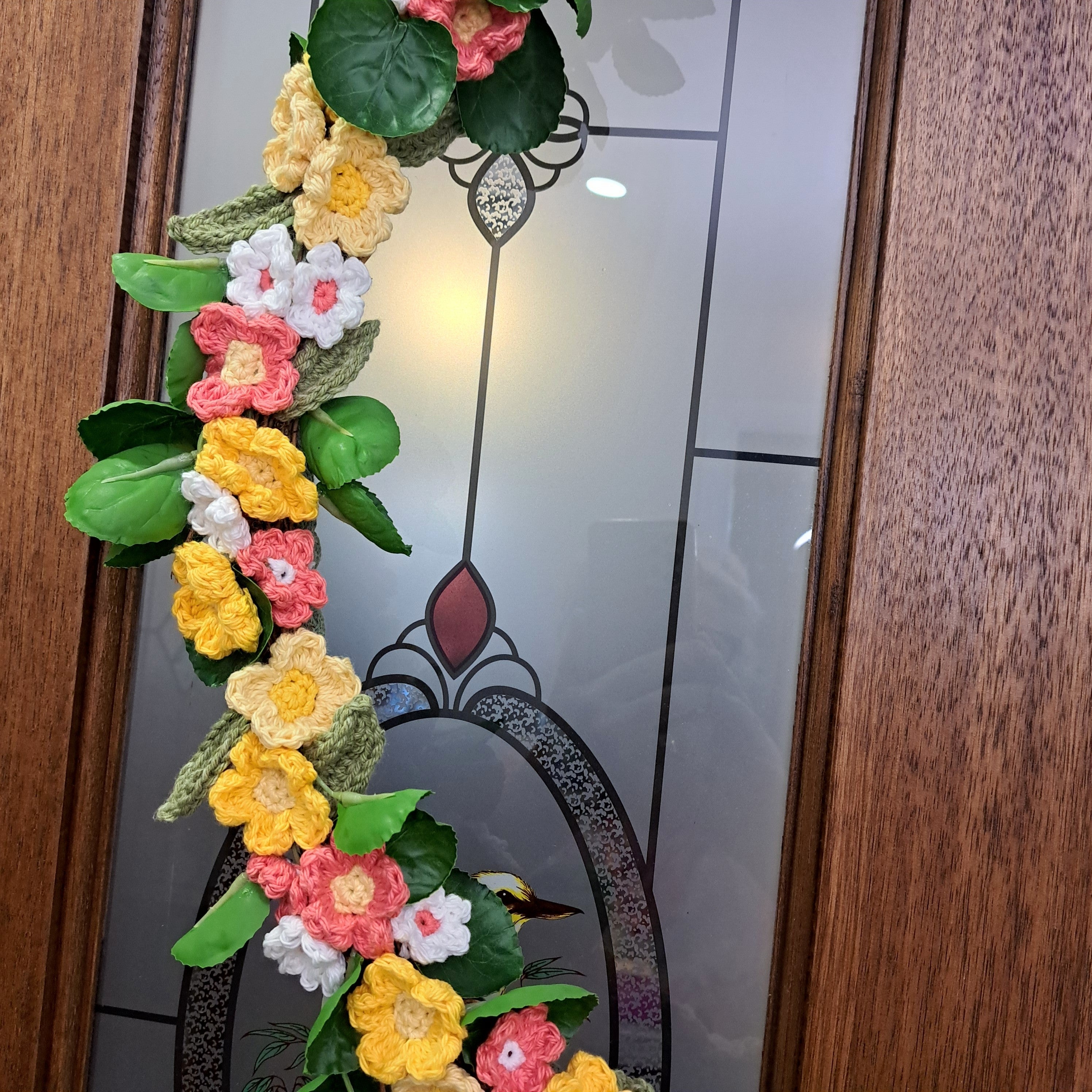 Handmade crochet spring flower wreath, yellows, pinks, white