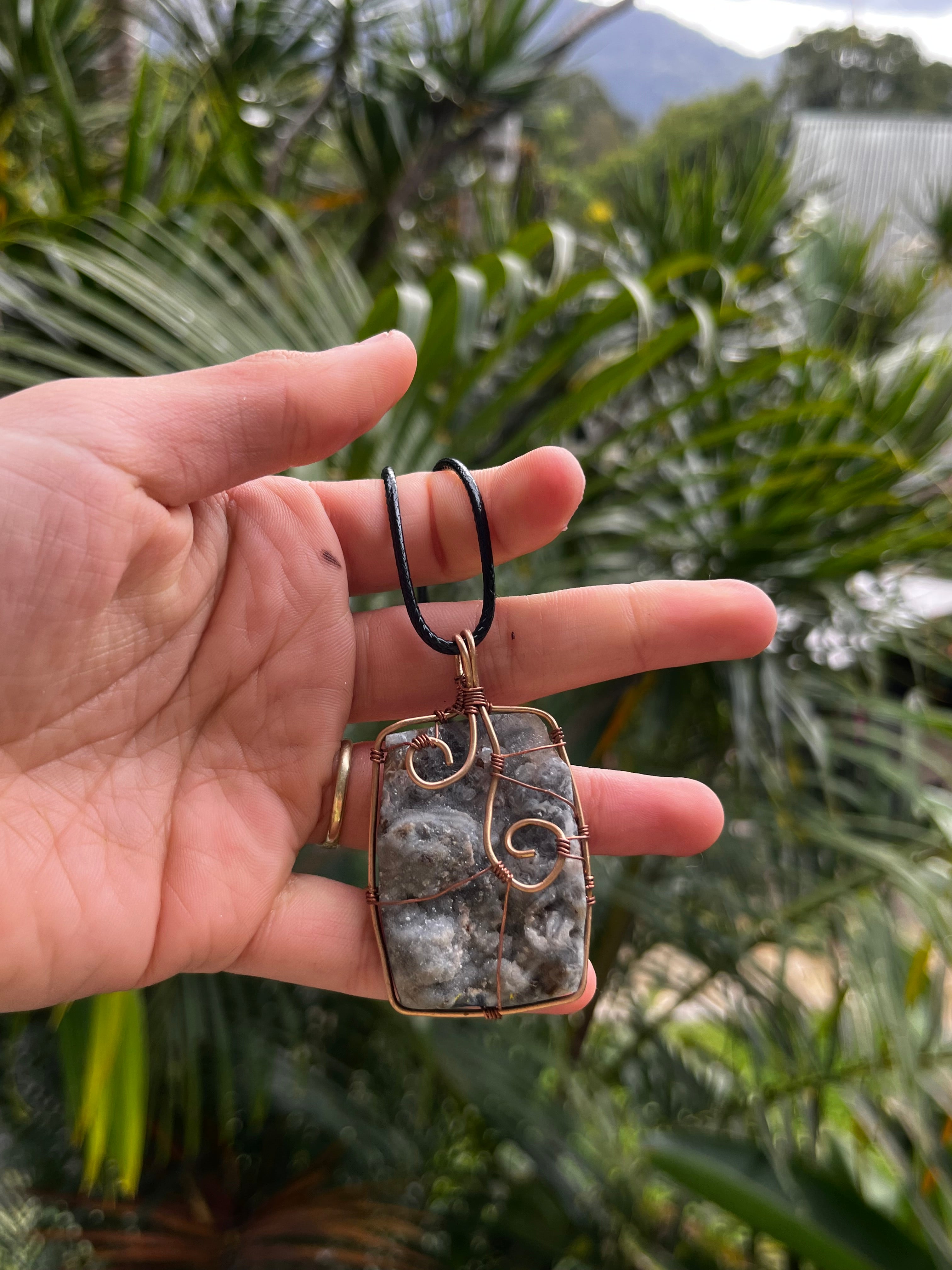Agate and bronze pendant