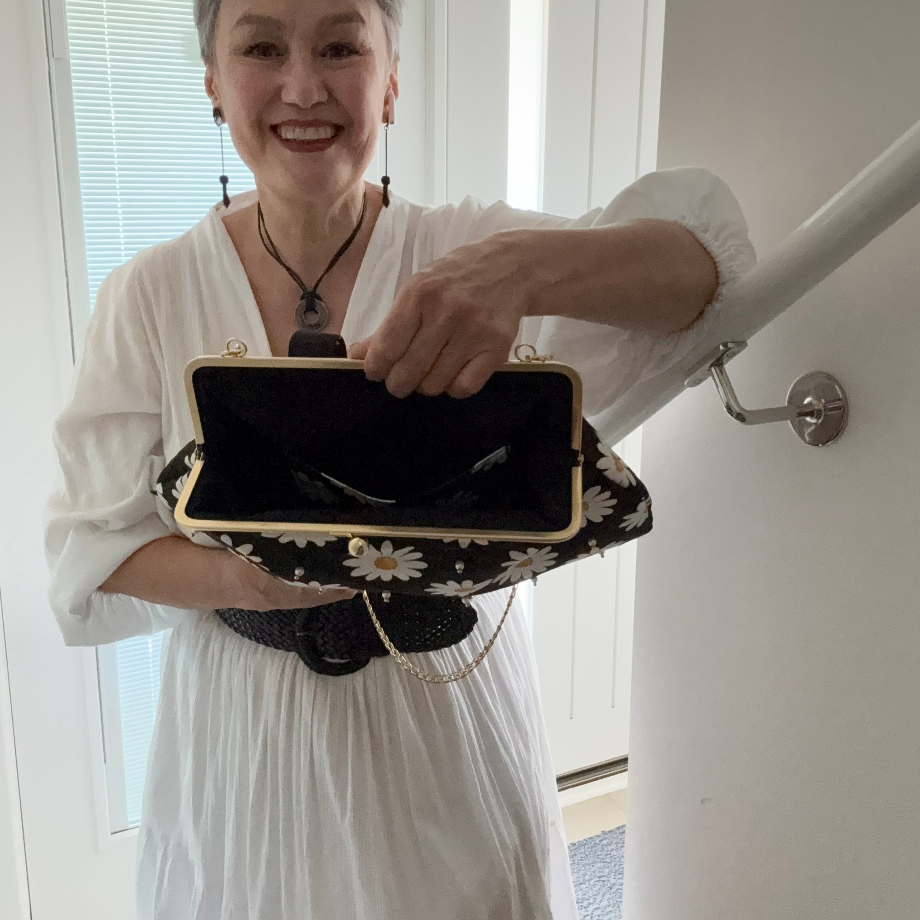 ‘Field of daisies’ metal frame purse