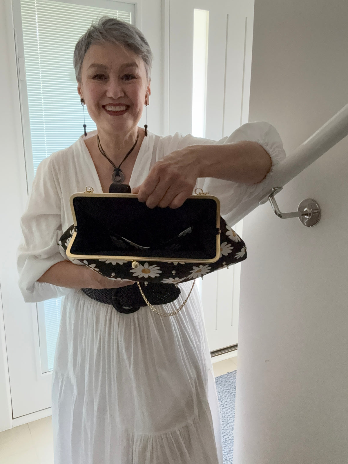 ‘Field of daisies’ metal frame purse