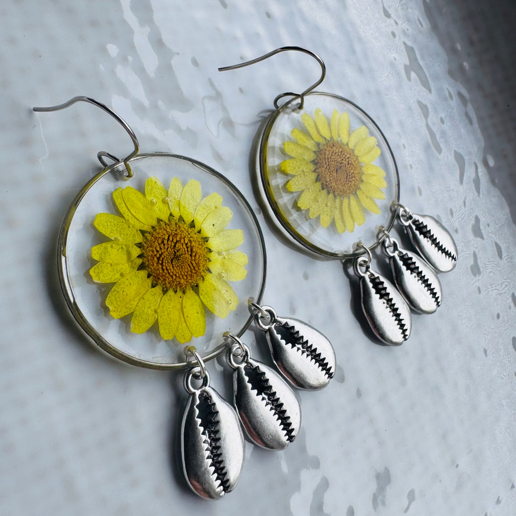 Yellow daisy and shell resin earrings