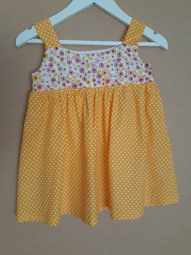 Cute child's dresses sizes 1-6. One-Of-A-Kind Print Bodice with Contrasting Spotty Skirt & Straps.