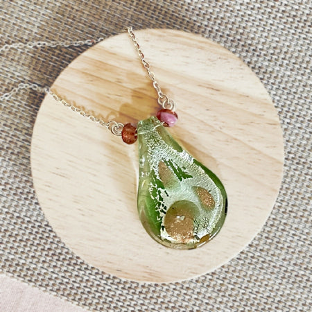 Green glass lampwork pendant on silver chain